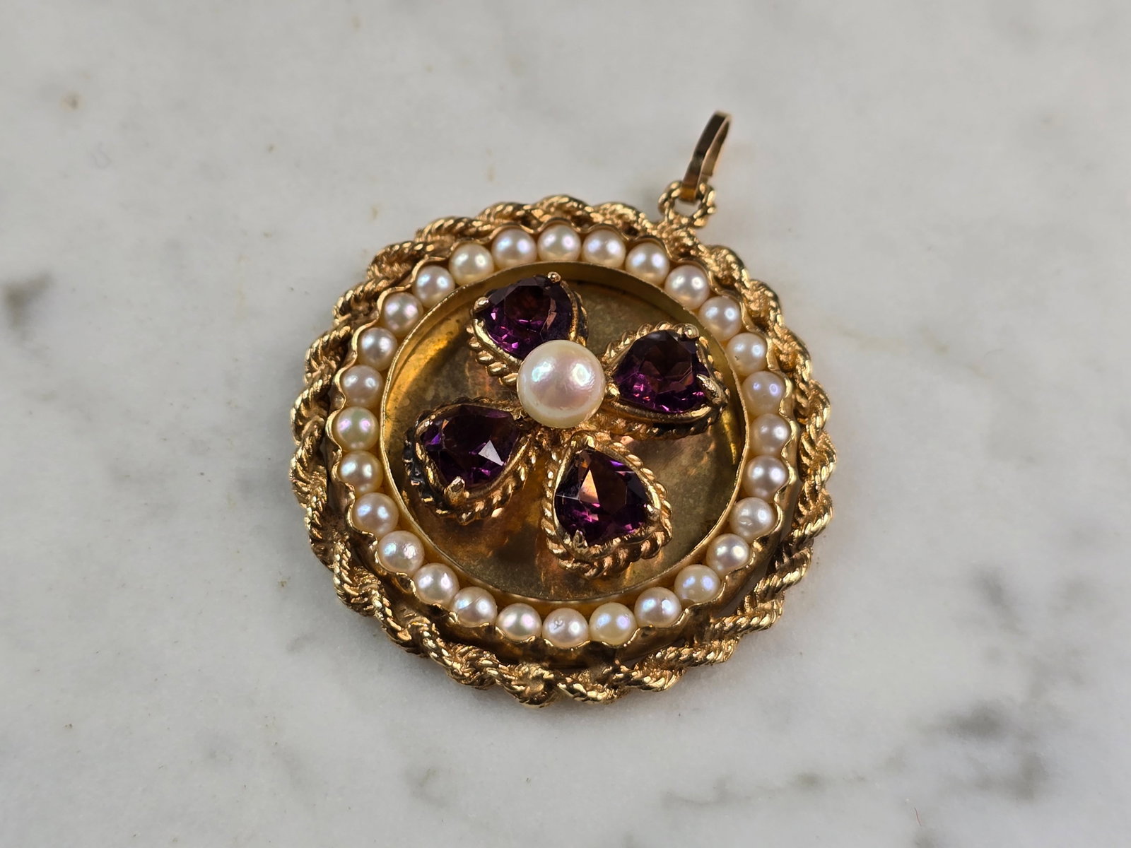 Womens Vintage Estate 14K Gold Amethyst & Pearl Pendant: A WOMEN'S VINTAGE ESTATE 14K YELLOW GOLD PENDANT WITH AMETHYST COLORED STONES WITH THREE SMALL DIAMOND CHIPS. THE PENDANT MEASURES 1 3/4" LONG BY 1 1/2" WIDE AND WEIGHS 16.2g. THE STONES ARE NOT NATUR