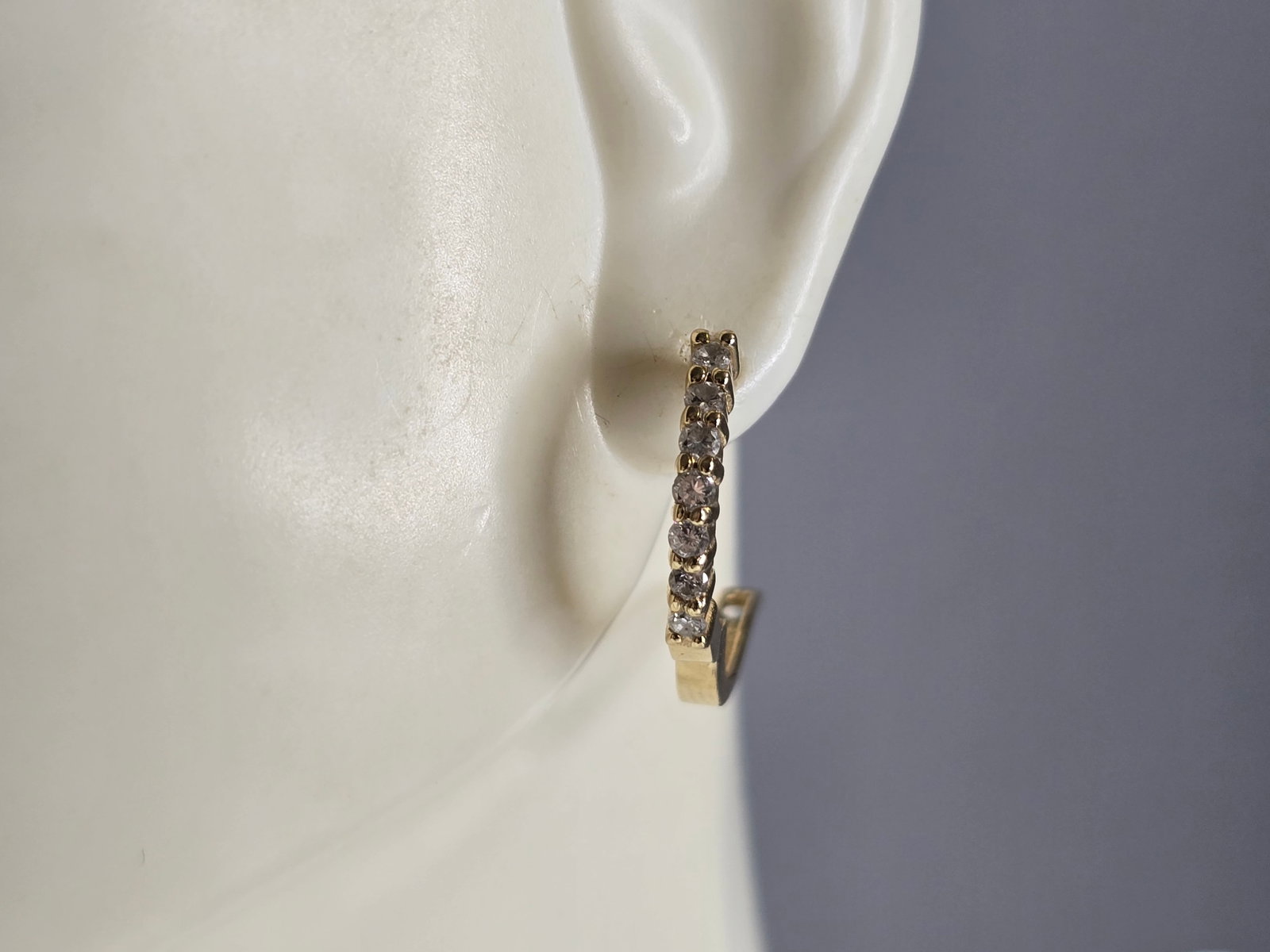Womens Vintage Estate 14K Yellow Gold Diamond Hoop Earrings: A PAIR OF 14K YELLOW GOLD DIAMOND HOOP EARRINGS. THE EARRINGS WEIGH 3.4g, AND MEASURE 3/4", BY 1/8". THERE ARE ABOUT 0.14cts OF DIAMONDS BETWEEN THE TWO. EARRINGS ARE MARKED ON THE STEM. ANY QUESTIONS