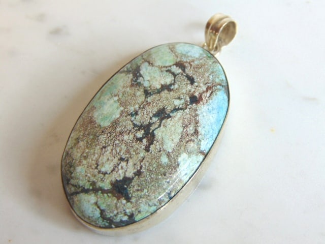 Womens Vintage Sterling Silver Chrysocolla Pendant: FOR SALE IS THIS LOVELY VINTAGE STERLING SILVER CHRYSOCOLLA COLORED PENDANT. NOT SURE IF STONES ARE REAL OR MAN MADE. THE PENDANT WEIGHS 21.5g. THE PENDANT MEASURES 2 1/2" WIDE BY 1 1/4" LONG. MAKES A