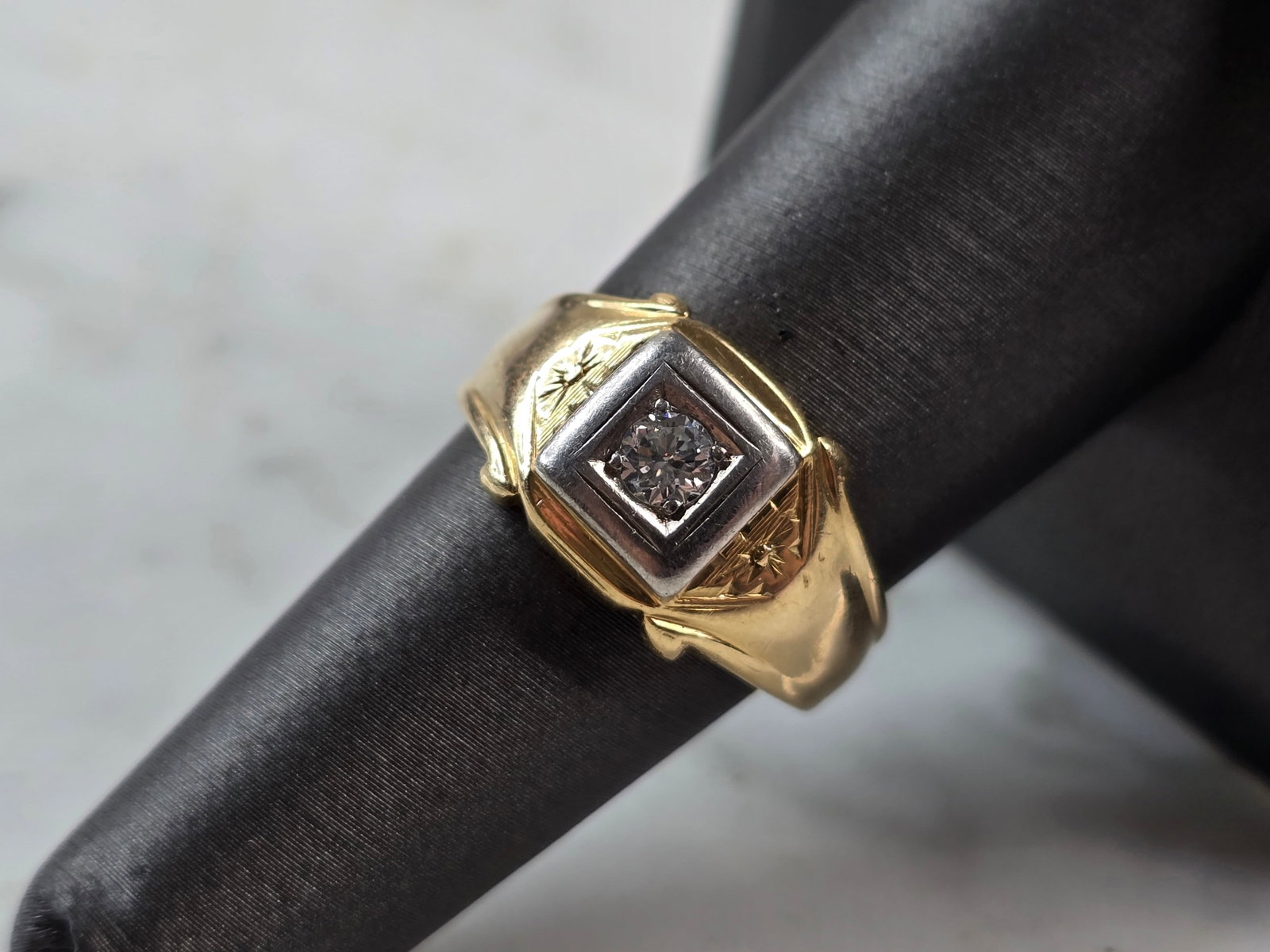 Mens Vintage Estate 14K Yellow Gold Diamond Ring: A MENS VINTAGE ESTATE 14K YELLOW GOLD DIAMOND RING WITH ABOUT .12cts OF DIAMONDS. THE RING IS A SIZE 7.75 AND WEIGHS 4.4g. THE FACE OF THE RING MEASURES 3/8" WIDE. THIS WOULD MAKE A LOVELY GIFT FOR TH