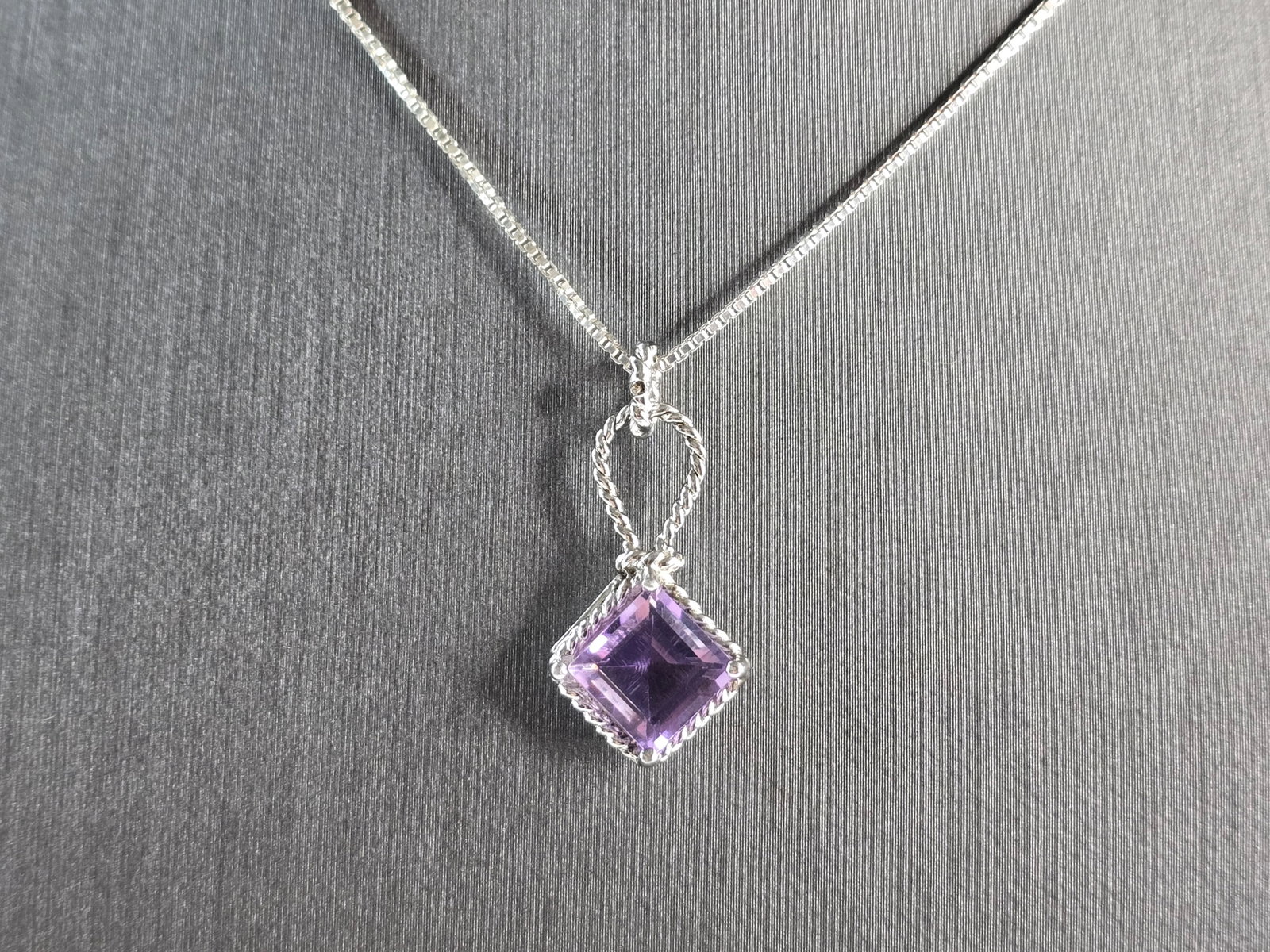 Womens Estate Sterling Silver Amethyst Pendant Necklace: A WOMENS ESTATE STERLING SILVER AMETHYST COLORED PENDANT WITH NECKLACE. THE PENDANT MEASURES 1" LONG BY 1/2" WIDE. THE NECKLACE MEASURES 18" LONG, AND IS ADJUSTABLE TO 16" LONG. TOGETHER THEY WEIGH 4.