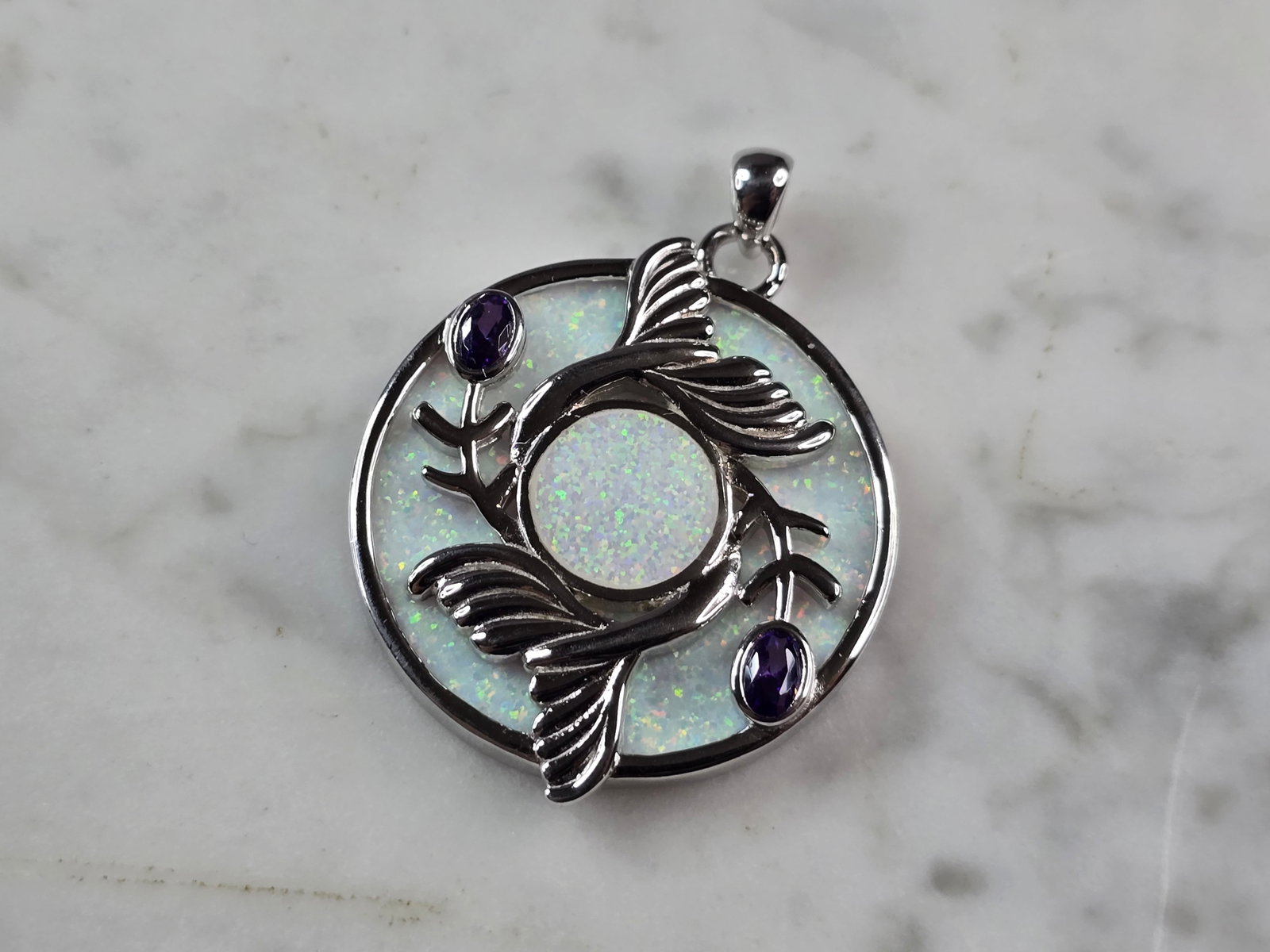 Womens Sterling Silver Opal Koi Fish Pendant: A WOMENS STERLING SILVER OPAL KOI FISH PENDANT. NOT SURE IF STONES ARE REAL OR MAN MADE. THE PENDANT WEIGHS 10.7g AND MEASURES 1 1/2" LONG BY 1 1/4" WIDE. MAKES A GREAT GIFT FOR THAT SOMEONE SPECIAL. 