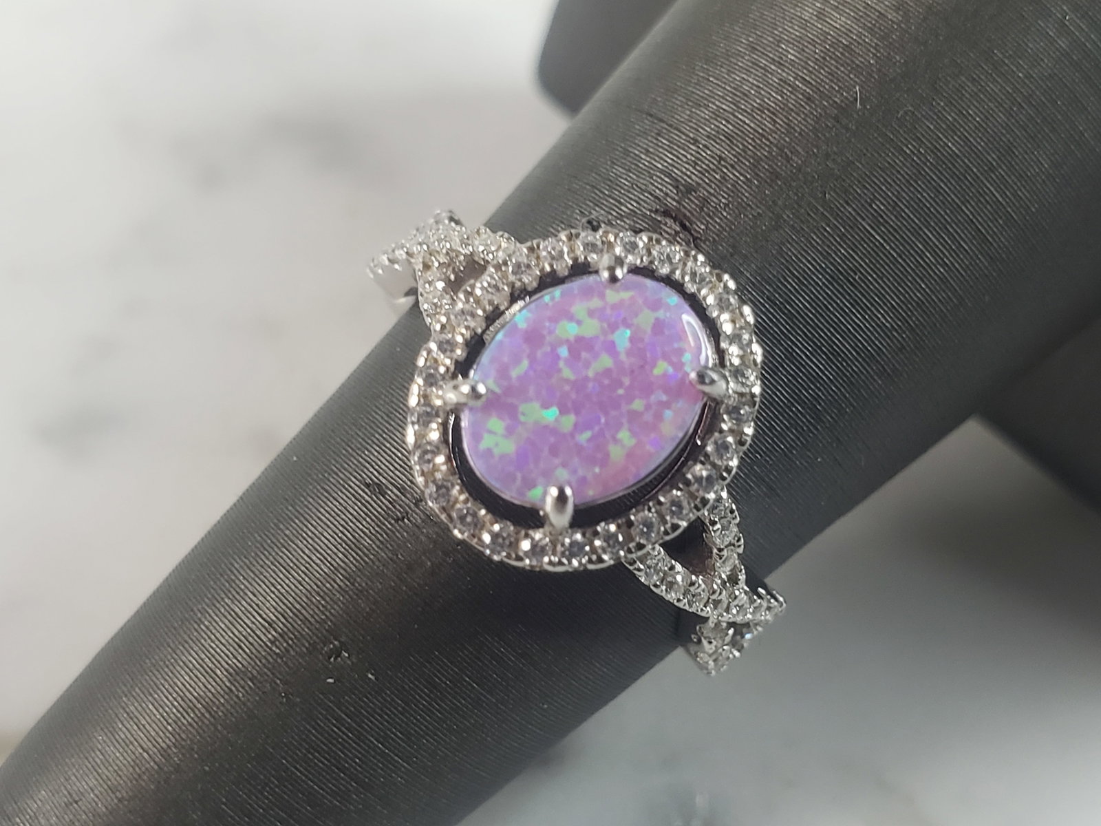 Womens Vintage Estate Sterling Silver Pink Opal Stone Ring: A WOMENS ESTATE STERLING SILVER PINK OPAL STONE RING. NOT SURE IF STONES ARE REAL OR MAN MADE. THE RING WEIGHS 2.7g AND IS A SIZE 7.75 FACE MEASURES 1/2". MAKES A GREAT GIFT FOR THAT SOMEONE SPECIAL. 