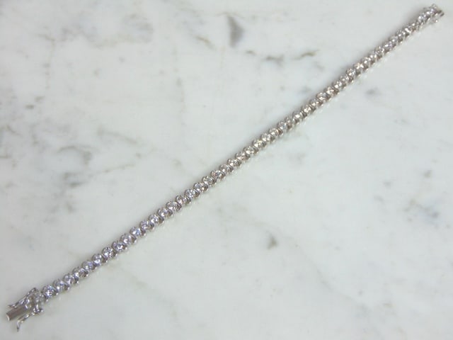 Womens Vintage Estate Sterling Silver CZ Bracelet: A WOMENS VINTAGE STERLING SILVER CZ BRACELET. BRACELET MEASURES 7 3/4" LONG AND 1/4" WIDE AND WEIGHS 15.0g. WOULD MAKE A LOVELY GIFT FOR THAT SOMEONE SPECIAL. BE SURE TO CHECK OUT SOME OF MY OTHER GRE