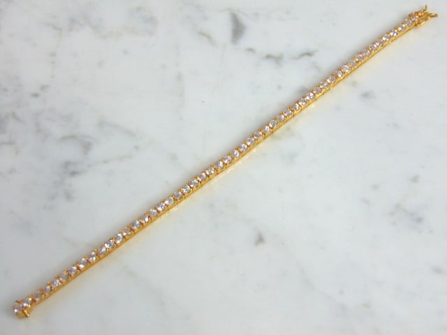 Womens Vintage Sterling Silver Gold Tone CZ Bracelet: A LOVELY VINTAGE ESTATE STERLING SILVER GOLD TONE CZ BRACELET. BRACELET MEASURES 7 1/2" LONG BY 1/8" WIDE AND WEIGHS 13.0g. THIS WOULD MAKE A LOVELY GIFT FOR THAT SOMEONE SPECIAL. ANY QUESTIONS, PLEAS