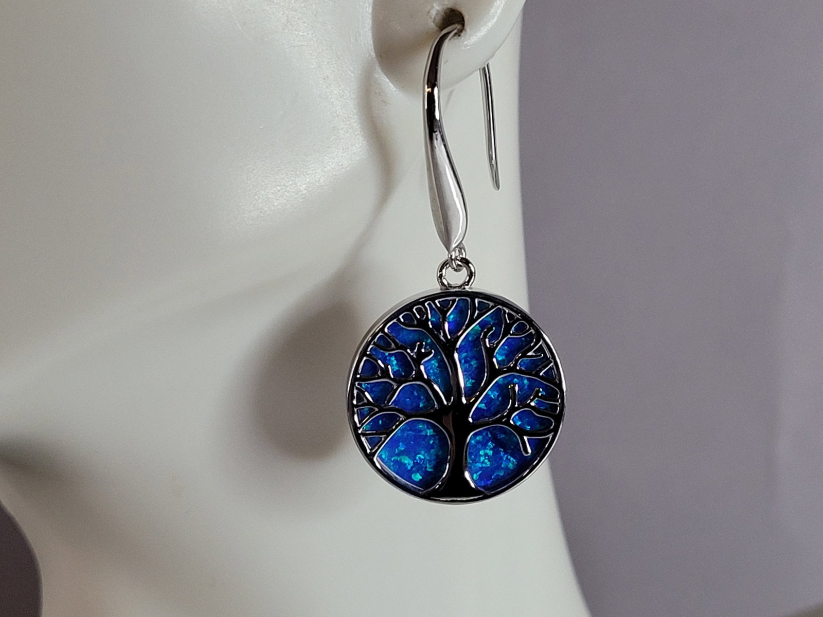 Womens Sterling Silver Blue Opal Tree of Life Earrings: A WOMENS ESTATE STERLING SILVER BLUE OPAL TREE OF LIFE EARRINGS. NOT SURE IF STONES ARE REAL OR MAN MADE. THE EARRINGS WEIGH 6.9g AND MEASURES 1 1/2" LONG BY 3/4" WIDE. MAKES A GREAT GIFT FOR THAT SOM