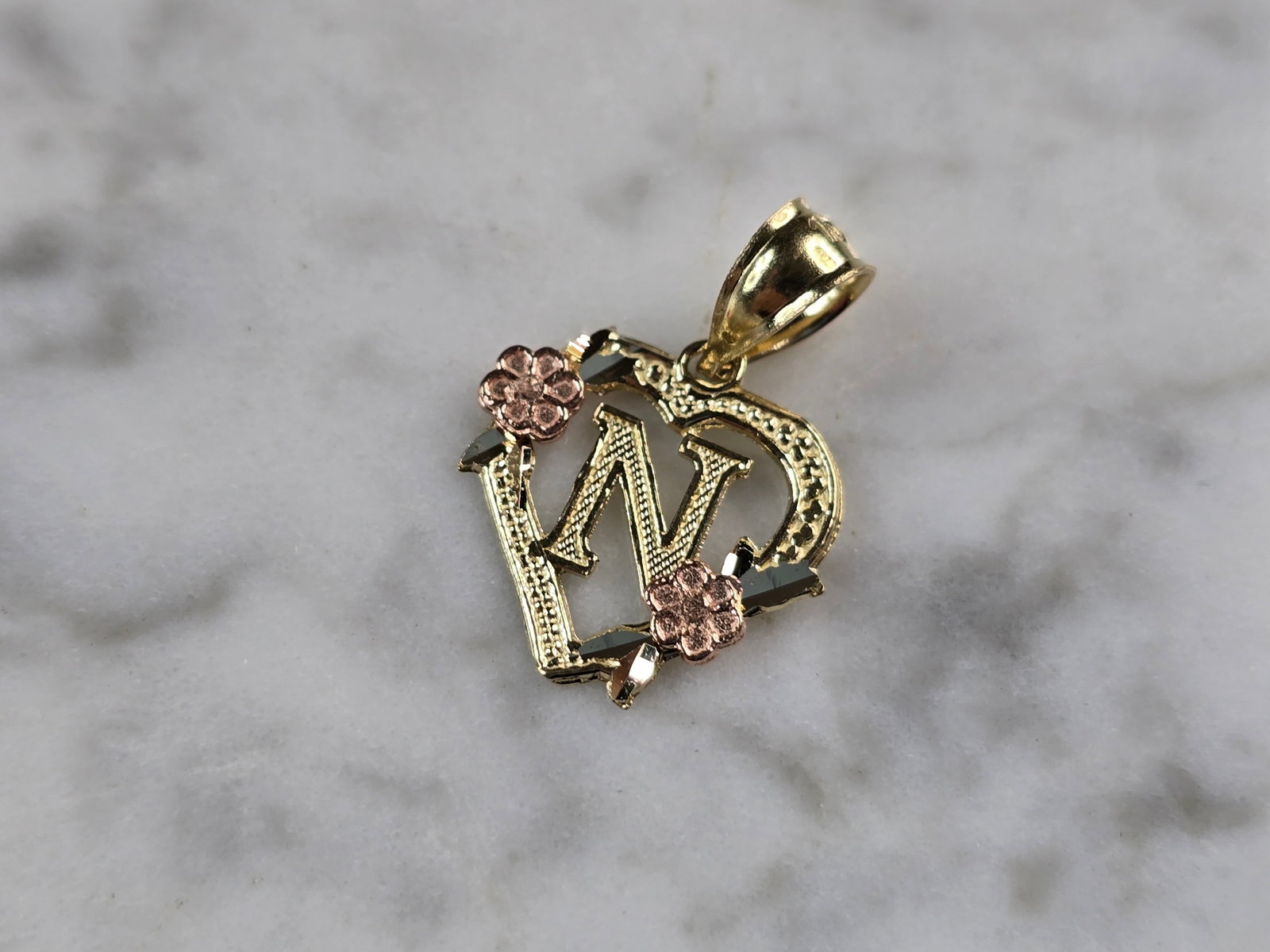 Womens 10K Yellow & Rose Gold Initial Letter " N " Heart Pendant: A WOMENS 10K YELLOW & ROSE GOLD "N" HEART PENDANT. PENDANT MEASURES 3/4" LONG BY 5/8" WIDE. TOTAL WEIGHT OF THE PENDANT IS 0.9g. WOULD MAKE A LOVELY GIFT FOR THAT SOMEONE SPECIAL. ANY QUESTIONS PLEASE