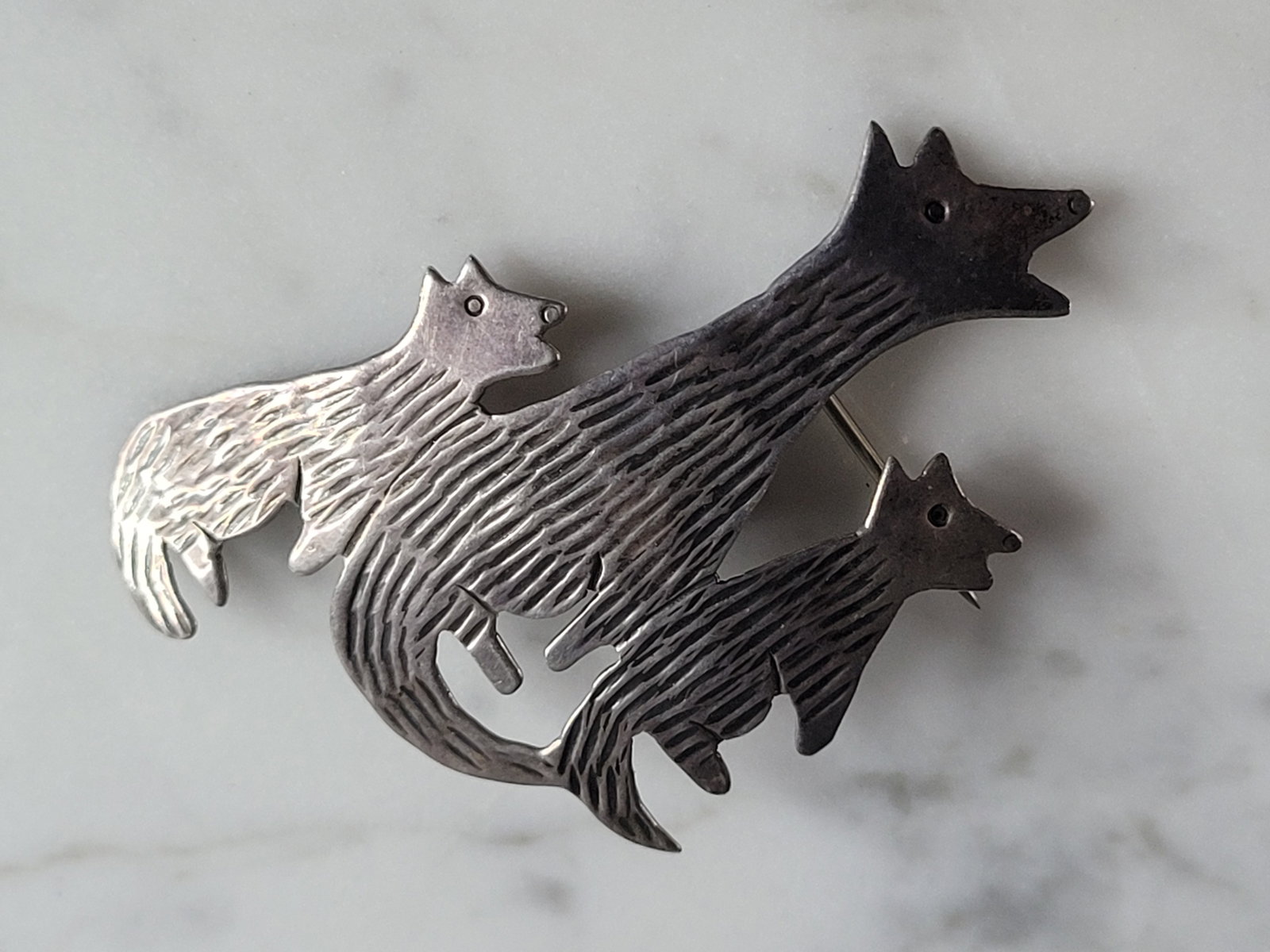 Womens Vintage Raymond Gasper Native Zuni Sterling Silver Coyote Brooch: A WOMENS VINTAGE ESTATE STERLING SILVER RAYMOND GASPER COYOTE BROOCH. THE BROOCH MEASURES 2" LONG BY 1 1/4" WIDE, AND WEIGHS 4.8g. ANY QUESTIONS, PLEASE DON'T HESITATE TO ASK. MAKES AN ATTRACTIVE GIFT