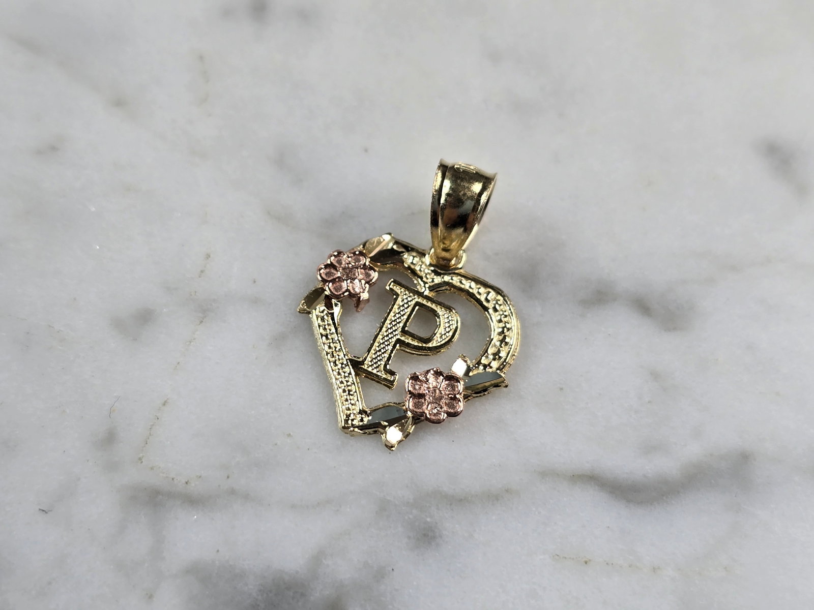 Womens 10K Yellow & Rose Gold Initial Letter " P " Heart Pendant: A WOMENS 10K YELLOW & ROSE GOLD "P" HEART PENDANT. PENDANT MEASURES 3/4" LONG BY 5/8" WIDE. TOTAL WEIGHT OF THE PENDANT IS 0.9g. WOULD MAKE A LOVELY GIFT FOR THAT SOMEONE SPECIAL. ANY QUESTIONS PLEASE