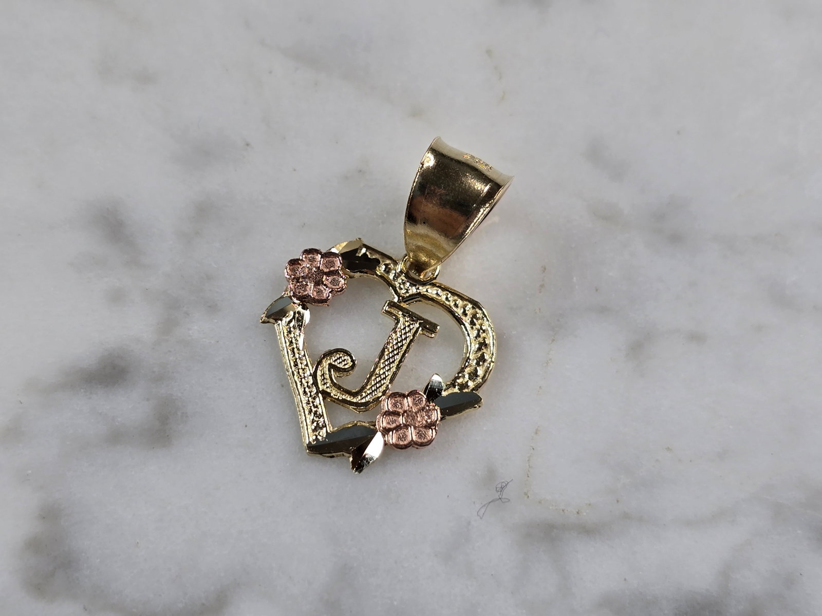 Womens 10K Yellow & Rose Gold Initial Letter " J " Heart Pendant: A WOMENS 10K YELLOW & ROSE GOLD "J" HEART PENDANT. PENDANT MEASURES 3/4" LONG BY 5/8" WIDE. TOTAL WEIGHT OF THE PENDANT IS 0.9g. WOULD MAKE A LOVELY GIFT FOR THAT SOMEONE SPECIAL. ANY QUESTIONS PLEASE