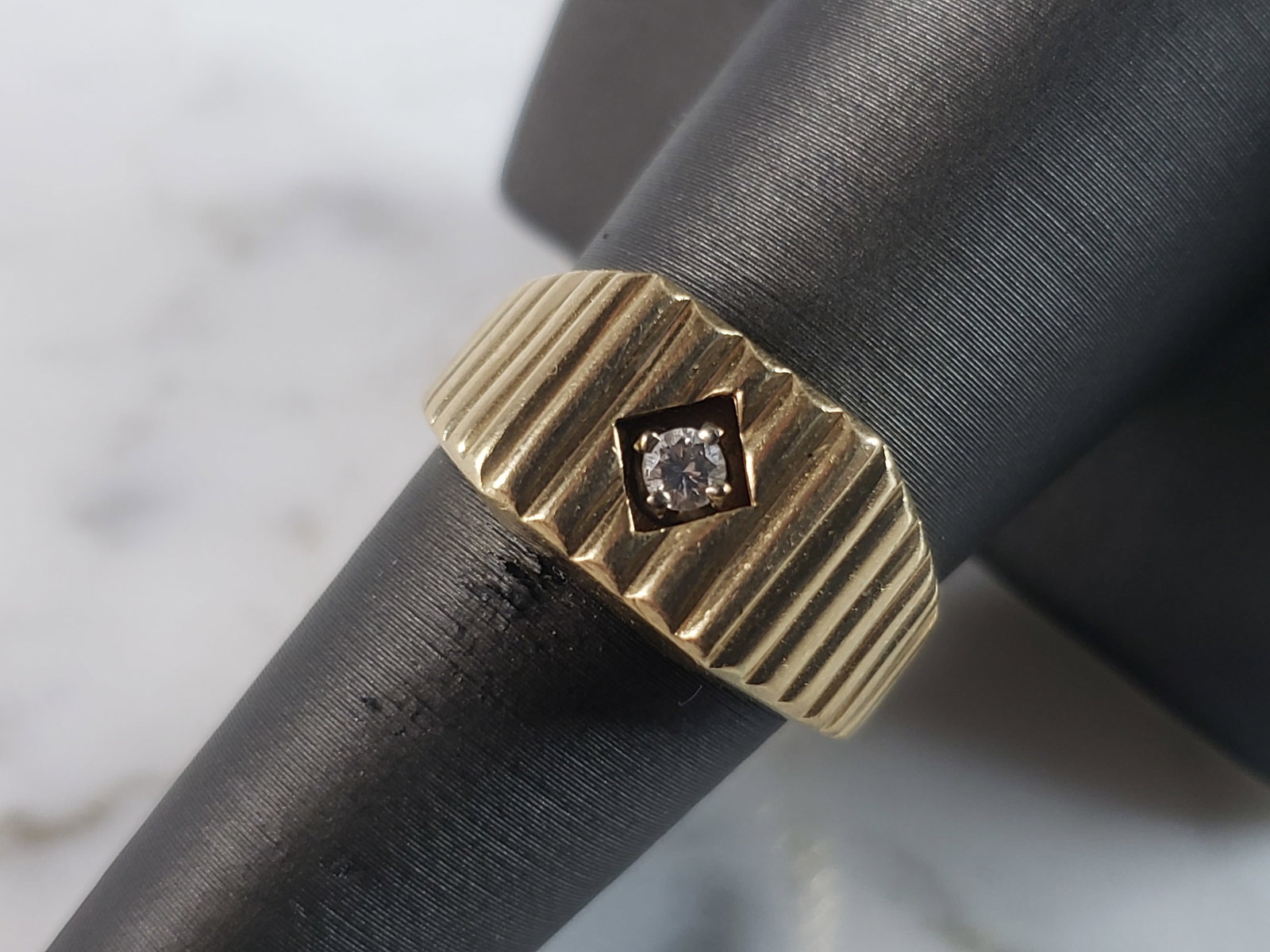 Mens Vintage Estate 14K Yellow Gold Modernist Diamond Ring: A MENS VINTAGE ESTATE 14K YELLOW GOLD MODERNIST DIAMOND RING WITH .10cts OF DIAMONDS. THE RING WEIGHS 6.9g. THE SIZE OF THE RING IS A 8.25. RING IS MARKED ON THE INSIDE OF THE BAND. THIS MAKES A LOVEL