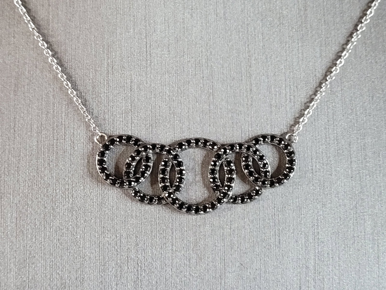 Womens Vintage Estate Sterling Silver CZ Infinity Knot Necklace: A WOMENS VINTAGE ESTATE STERLING SILVER CZ INFINITY KNOT NECKLACE . NECKLACE WEIGHS 5.3g, AND MEASURES 18" BY 5/8". WOULD MAKE A GREAT GIFT FOR THAT SPECIAL SOMEONE. ANY QUESTIONS PLEASE DO NOT HESITA