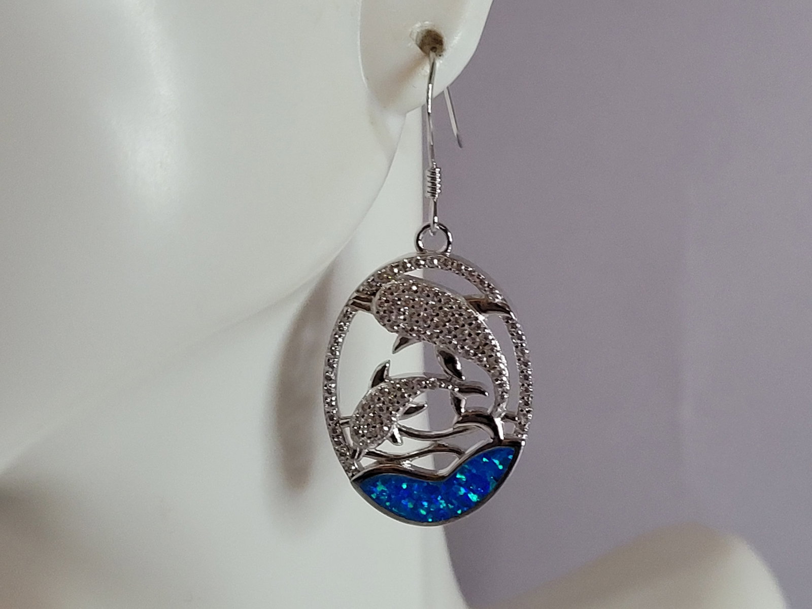 Womens Estate Sterling Silver Modernist Opal Dolphin Earrings: WOMENS ESTATE STERLING SILVER MODERNIST OPAL COLORED DOLPHIN EARRINGS THAT WEIGHS 8.6g AND MEASURES 1 1/2" LONG BY 3/4" WIDE. NOT SURE IF STONES ARE REAL OR MAN MADE. ANY QUESTIONS, PLEASE DO NOT HESI