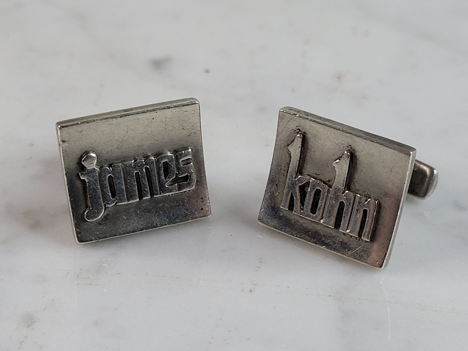 Mens Vintage Estate Sterling Silver James Kohn Cufflinks: A MEN'S VINTAGE ESTATE STERLING SILVER MODERNIST CUFFLINKS. THE CUFFLINKS WEIGH 19.4g. THE CUFFLINKS MEASURE 3/4" WIDE BY 3/4" LONG. THE NAME IS "JAMES KOHN". ANY QUESTIONS PLEASE DO NOT HESITATE TO A