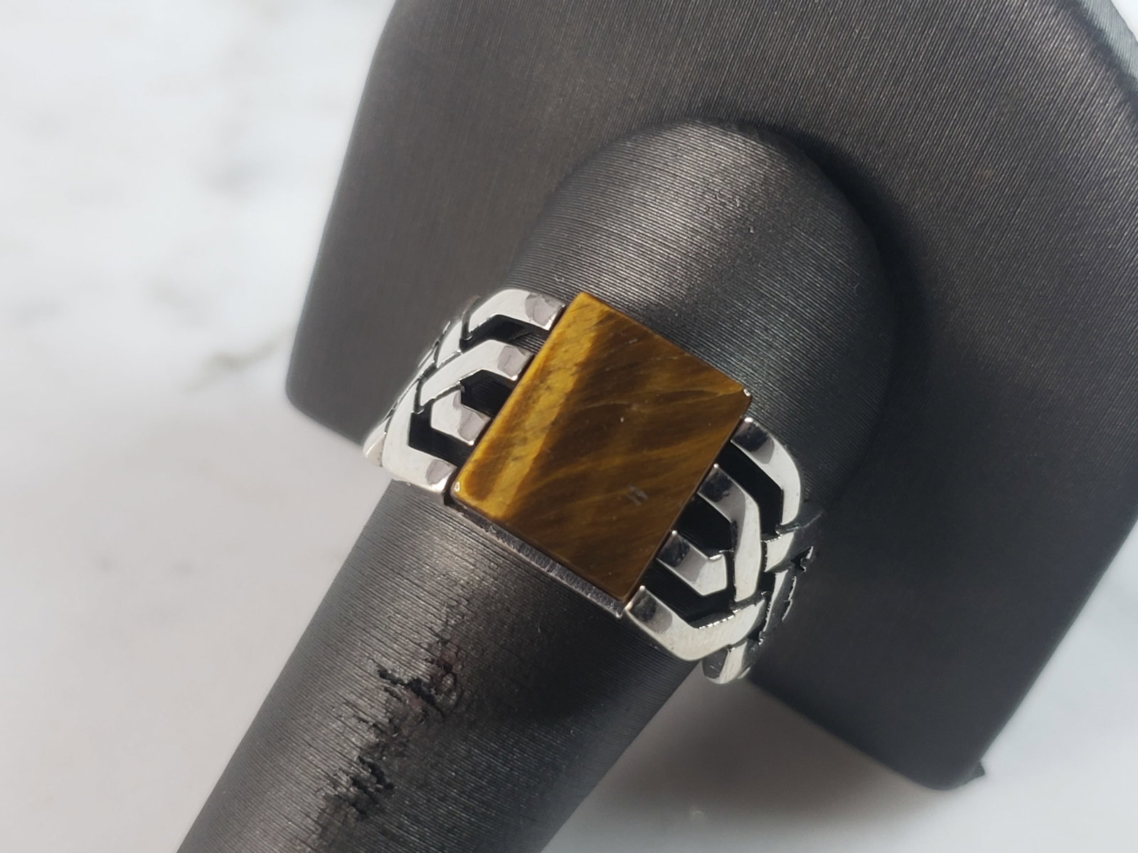 Mens Sterling Silver Tigers Eye Ring: A MENS STERLING SILVER TIGERS EYE RING. THE RING IS A SIZE 9.0 AND WEIGHS 7.4g. THE WIDTH OF THE RING IS 1/2". THE RING MAKES A BEAUTIFUL, IMPRESSIVE GIFT FOR THAT SOMEONE SPECIAL. ANY QUESTIONS, PLEA