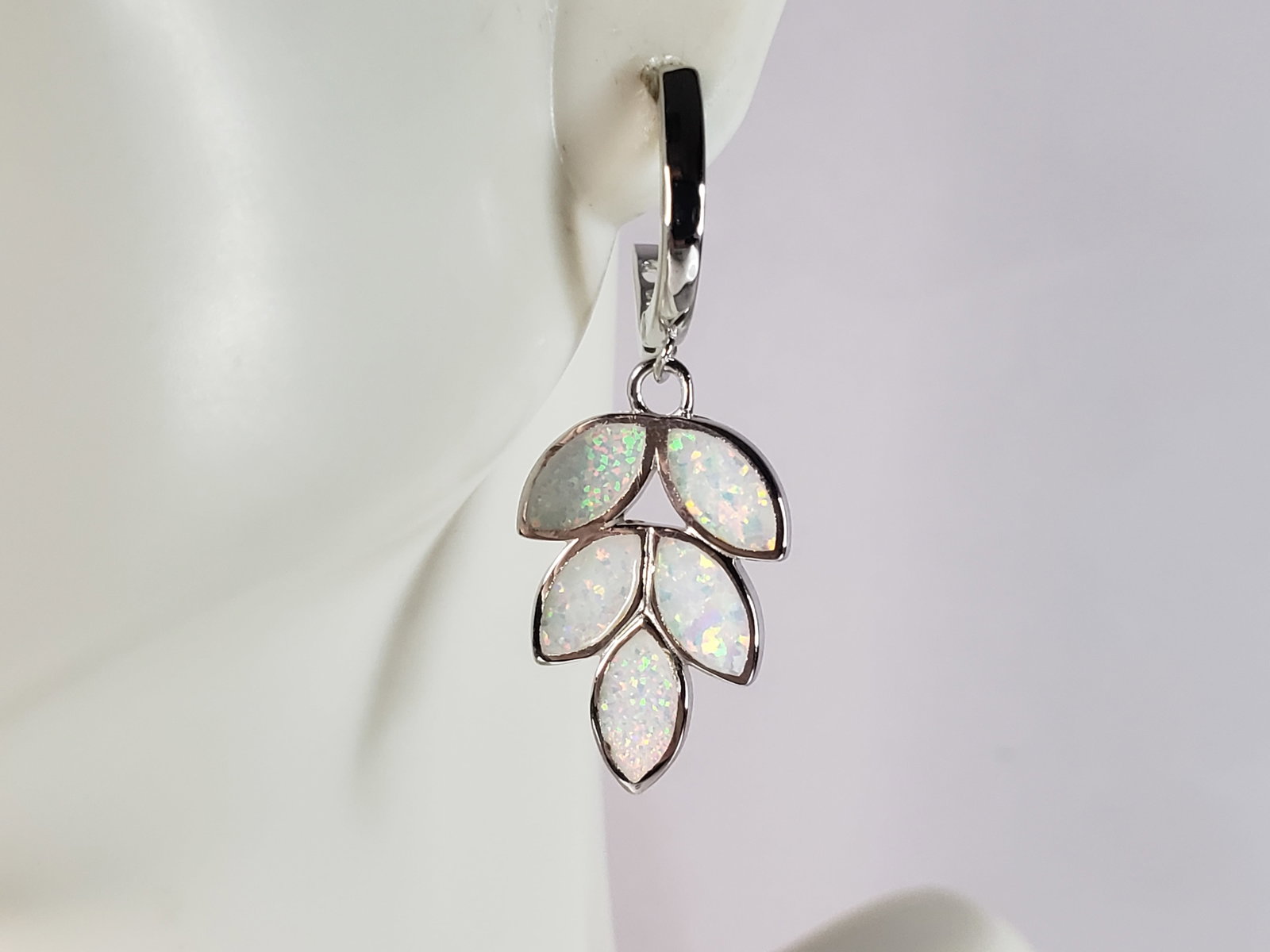 Womens Estate Sterling Silver Opal Leaf Earrings: A PAIR OF WOMENS STERLING SILVER OPAL COLORED LEAF EARRINGS THAT WEIGH 4.3g AND MEASURES 1 3/8" LONG BY 1/2" WIDE. NOT SURE IF STONES ARE REAL OR MAN MADE. ANY QUESTIONS, PLEASE DO NOT HESITATE TO ASK