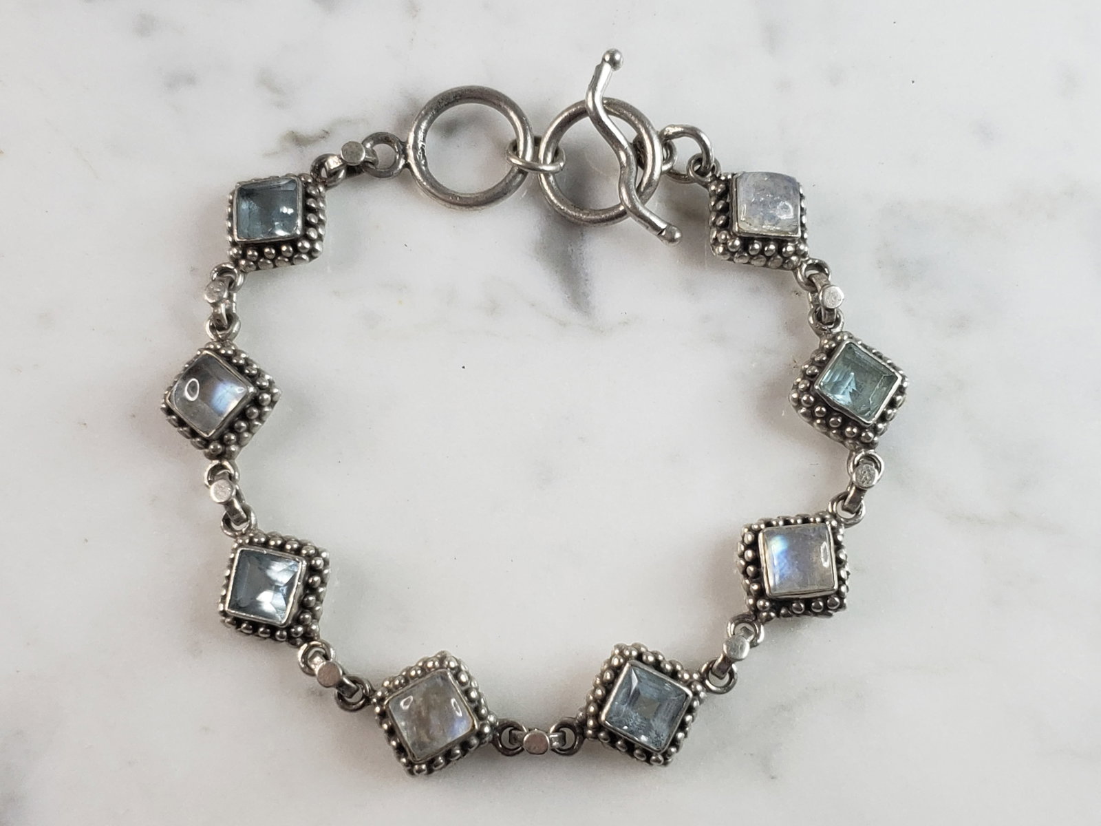 Womens Vintage Estate Sterling Silver Modernist Bracelet: A WOMENS VINTAGE ESTATE STERLING SILVER MODERNIST BRACELET. NOT SURE IF STONES ARE NATURAL OR MAN MADE. BRACELET MEASURES 8" LONG BY 3/8" WIDE AND WEIGHS 21.5g. THIS WOULD MAKE A LOVELY GIFT FOR THAT 