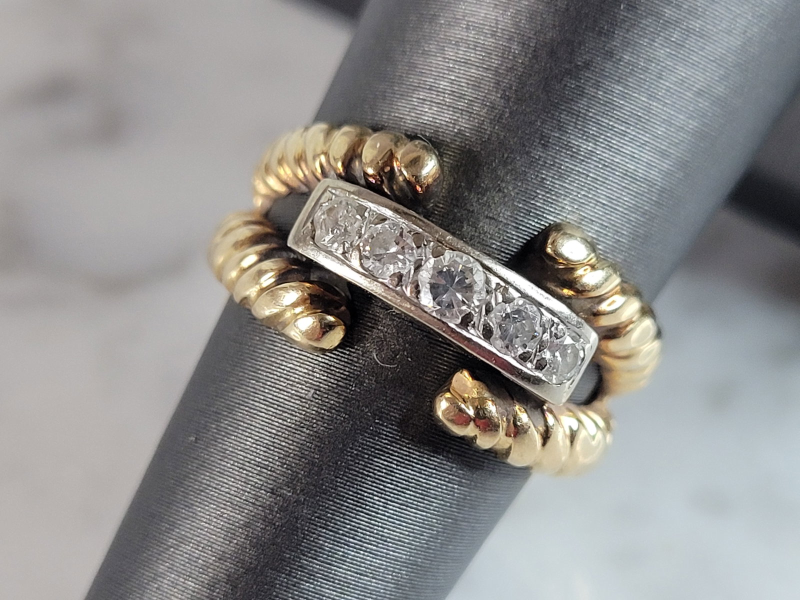 Womens Vintage Estate 14K White & Yellow Gold Diamond Ring: A WOMENS VINTAGE ESTATE 14K WHITE & YELLOW GOLD DIAMOND RING. THE RING WEIGHS 6.2g, AND IS A SIZE 6.5. THERE ARE ABOUT .25cts OF DIAMONDS. ONE OF THE DIAMONDS HAS A TINY CHIP. NOTICABLE UNDER A MAGNIF