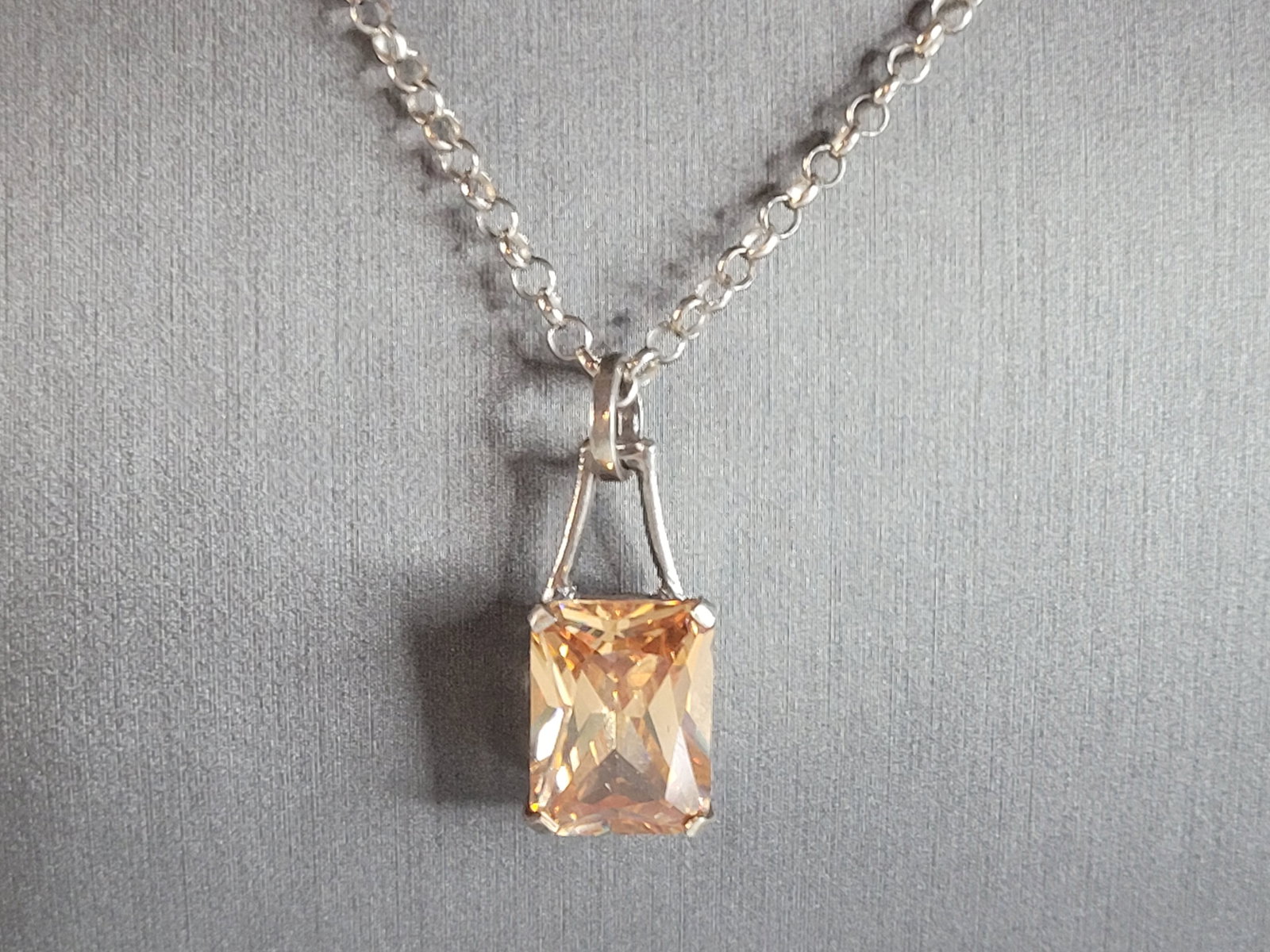 Womens Sterling Silver Israel Necklace W/ Citrine ? Stone Pendant: A WOMENS STERLING SILVER NECKLACE WITH CITRINE LIKE STONE PENDANT. NOT SURE IF THE STONE IS REAL OR MAN MADE. THE PENDANT MEASURES 1 1/4" BY 1/2". THE NECKLACE MEASURES 19" LONG. TOGETHER THEY WEIGH 1