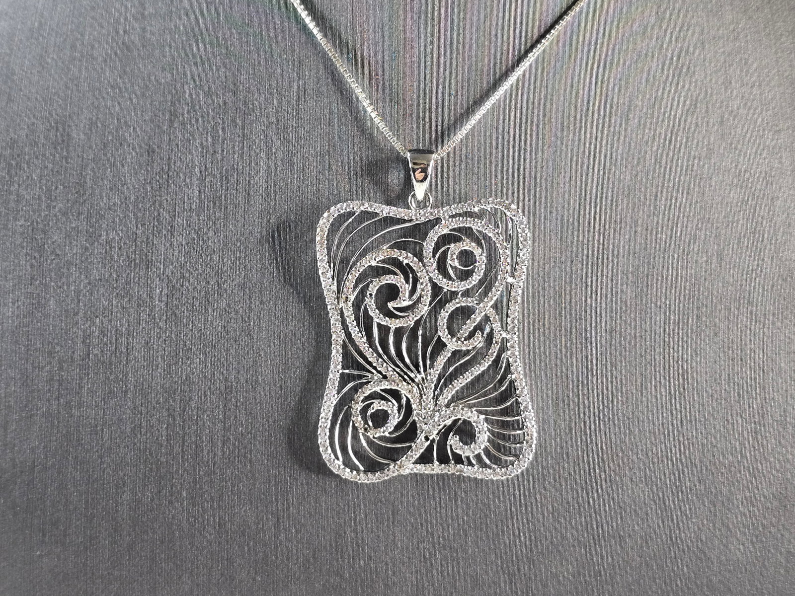 Womens Sterling Silver Modernist CZ Pendant Necklace: A WOMENS ESTATE STERLING SILVER MODERNIST PENDANT NECKLACE. THE NECKLACE MEASURES ABOUT 18" LONG, AND THE PENDANT MEASURES 1 7/8" LONG BY 1 1/4" WIDE. TOGETHER THEY WEIGH 8.3g. ANY QUESTIONS PLEASE DO