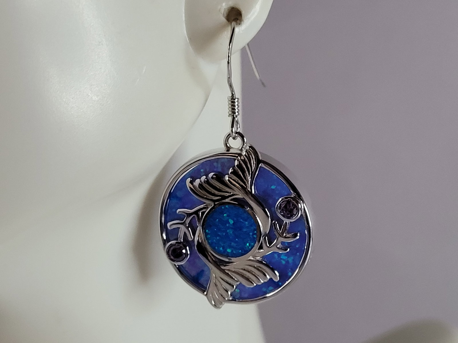 Womens Sterling Silver Blue Opal Mermaid Tail Earrings: A WOMENS ESTATE STERLING SILVER BLUE OPAL MERMAID EARRINGS. NOT SURE IF STONES ARE REAL OR MAN MADE. THE EARRINGS WEIGH 9.0g AND MEASURES 1 3/8" LONG BY 3/4" WIDE. MAKES A GREAT GIFT FOR THAT SOMEONE 