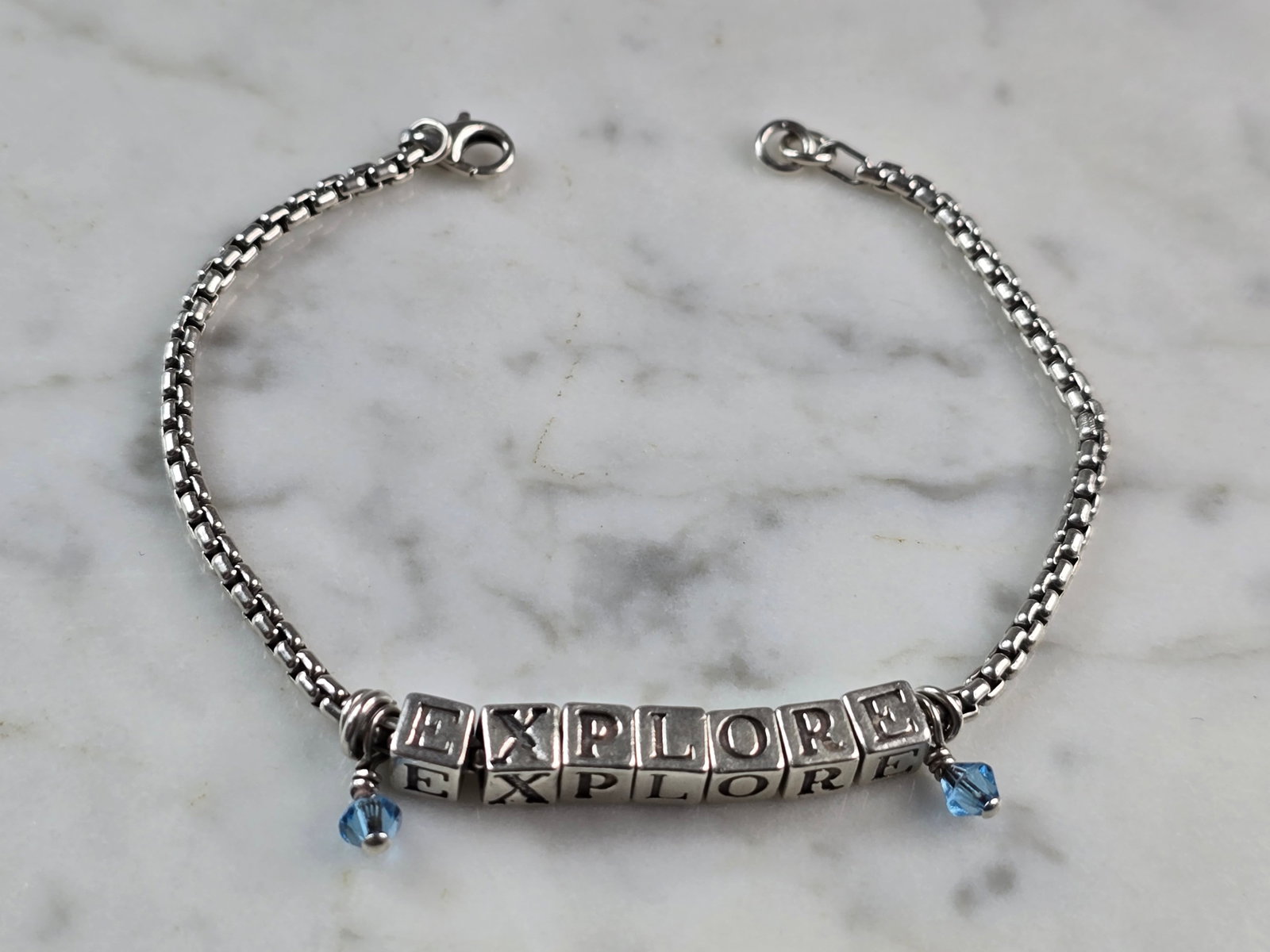 Womens Vintage Estate Sterling Silver EXPLORE Bracelet: FOR SALE IS THIS WOMENS VINTAGE ESTATE STERLING SILVER MODERNIST " EXPLORE " BRACELET. THE TOTAL WEIGHT IS 11.1g. THE BRACELET MEASURES 7 1/4" LONG BY 1/4" WIDE. MAKES A GREAT GIFT FOR THAT SPECIAL SO