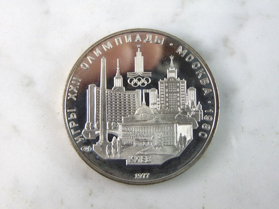 1977 USSR 5 Rubles Summer Olympics Silver Coin: FOR SALE IS THIS 1977 USSR 5 RUBLES SUMMER OLYMPICS HAMMER THROW SILVER COIN. COIN WEIGHS 16.5g. COIN APPEARS TO BE IN VERY GOOD CONDITION, UNC, AND SOME TONING AROUND THE EDGES, HOWEVER WE ARE NOT CO