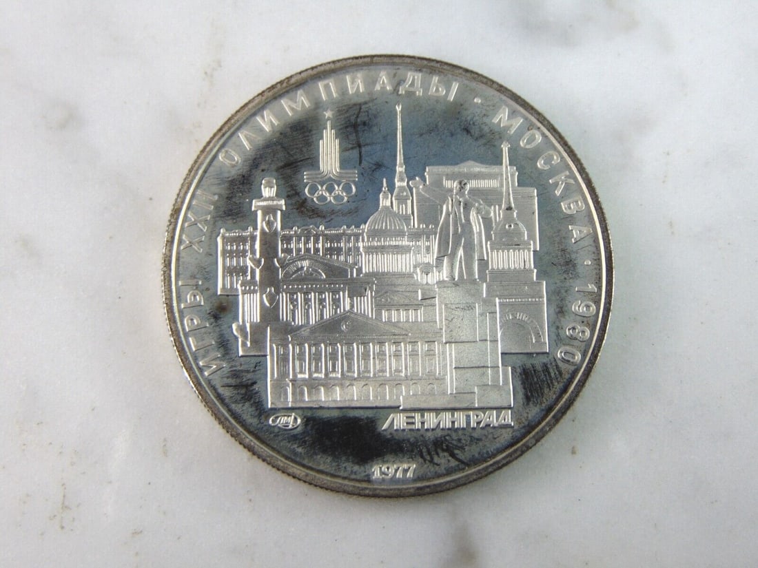 1977 USSR 5 Rubles Summer Olympics Silver Coin: FOR SALE IS THIS 1977 USSR 5 RUBLES SUMMER OLYMPICS SILVER COIN. COIN WEIGHS 16.8g. COIN APPEARS TO BE IN VERY GOOD CONDITION, UNC, AND SOME TONING AROUND THE EDGES, HOWEVER WE ARE NOT COIN EXPERTS WH