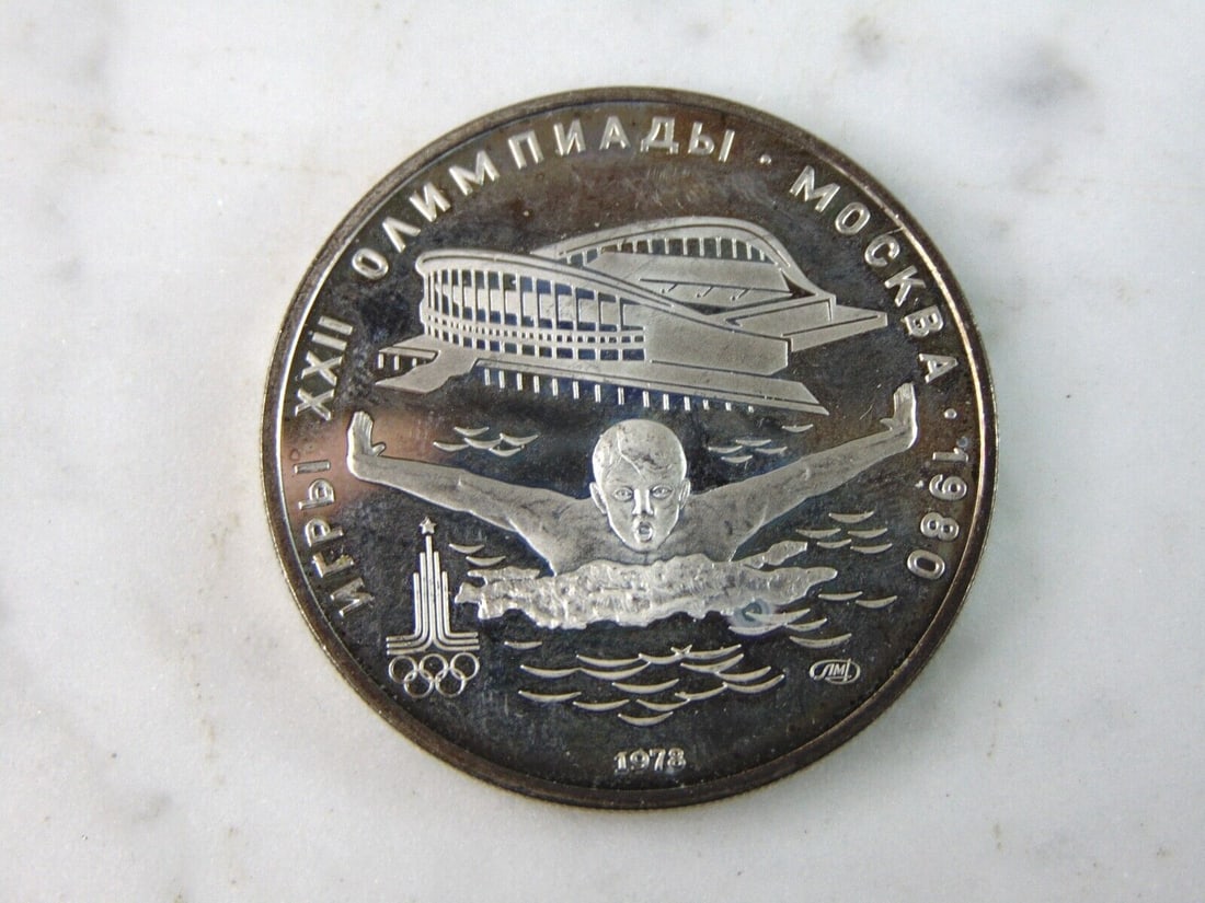 1978 USSR 5 Rubles Summer Olympics Swimming Silver Coin: FOR SALE IS THIS 1978 USSR 5 RUBLES SUMMER OLYMPICS SWIMMING SILVER COIN. COIN WEIGHS 16.5g. COIN APPEARS TO BE IN VERY GOOD CONDITION, UNC, AND SOME TONING AROUND THE EDGES, HOWEVER WE ARE NOT COIN E