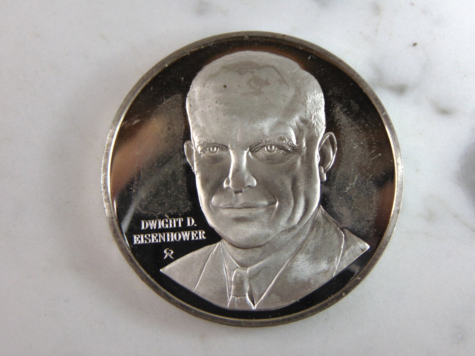 Sterling Silver President Dwight D. Eisenhower Collectible Coin: FOR SALE IS THIS STERLING SILVER PRESIDENT DWIGHT D. EISENHOWER COLLECTIBLE COIN. COIN WEIGHS 39.8g. COIN APPEARS TO BE IN VERY GOOD CONDITION, HOWEVER WE ARE NOT COIN EXPERTS WHEN IT COMES TO PROPER 