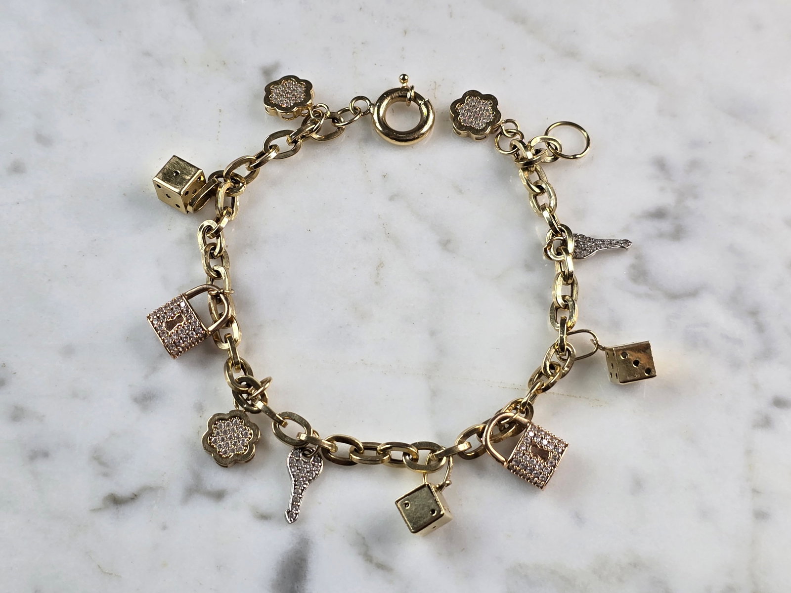 Womens Vintage Estate 14K Yellow Gold CZ Charm Bracelet: A LOVELY WOMENS VINTAGE ESTATE 14K YELLOW GOLD CZ CHARM BRACELET. THE BRACELET WEIGHS 11.9g, AND MEASURES 8" LONG. WOULD MAKE A GREAT GIFT FOR THAT SOMEONE SPECIAL. ANY QUESTIONS PLEASE DONT HESITATE 