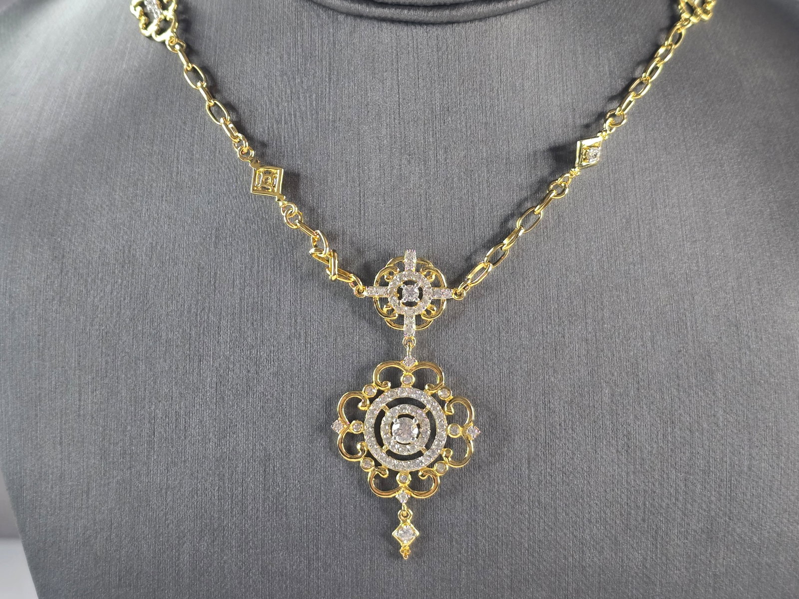 Womens Sterling Silver Gold Tone CZ Pendant Necklace: A WOMENS GOLD TONE STERLING SILVER PENDANT NECKLACE. THE TOTAL WEIGHT IS 13.7g. PENDANT MEASURES 2" LONG BY 1" WIDE. NECKLACE MEASURES 18" LONG. STONES ARE CZ. MAKES A GREAT GIFT FOR THAT SPECIAL SOME