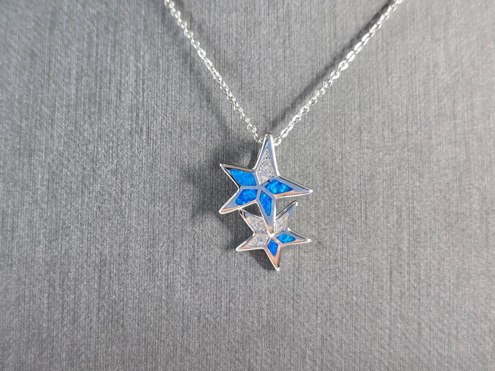 Womens Sterling Silver Blue Opal Star Pendant Necklace: A WOMENS STERLING SILVER BLUE OPAL MODERNIST STAR PENDANT. THE PENDANT WITH NECKLACE WEIGHS 3.8g. PENDANT MEASURES 7/8" LONG BY 5/8" WIDE, AND THE NECKLACE MEASURES 18" LONG, ADJUSTABLE TO 16". NOT SU