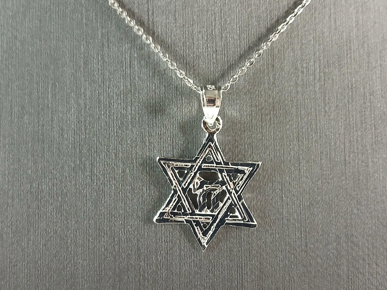Sterling Silver Jewish Judaica Star of David Chai Pendant Necklace: A STERLING SILVER STAR OF DAVID CHAI PENDANT WITH NECKLACE. THE PENDANT WITH NECKLACE WEIGHS 2.6g. THE NECKLACE MEASURES 18" LONG, AND IS ADJUSTABLE TO 16" LONG. THE PENDANT MEASURES 1 1/8" LONG BY 5/