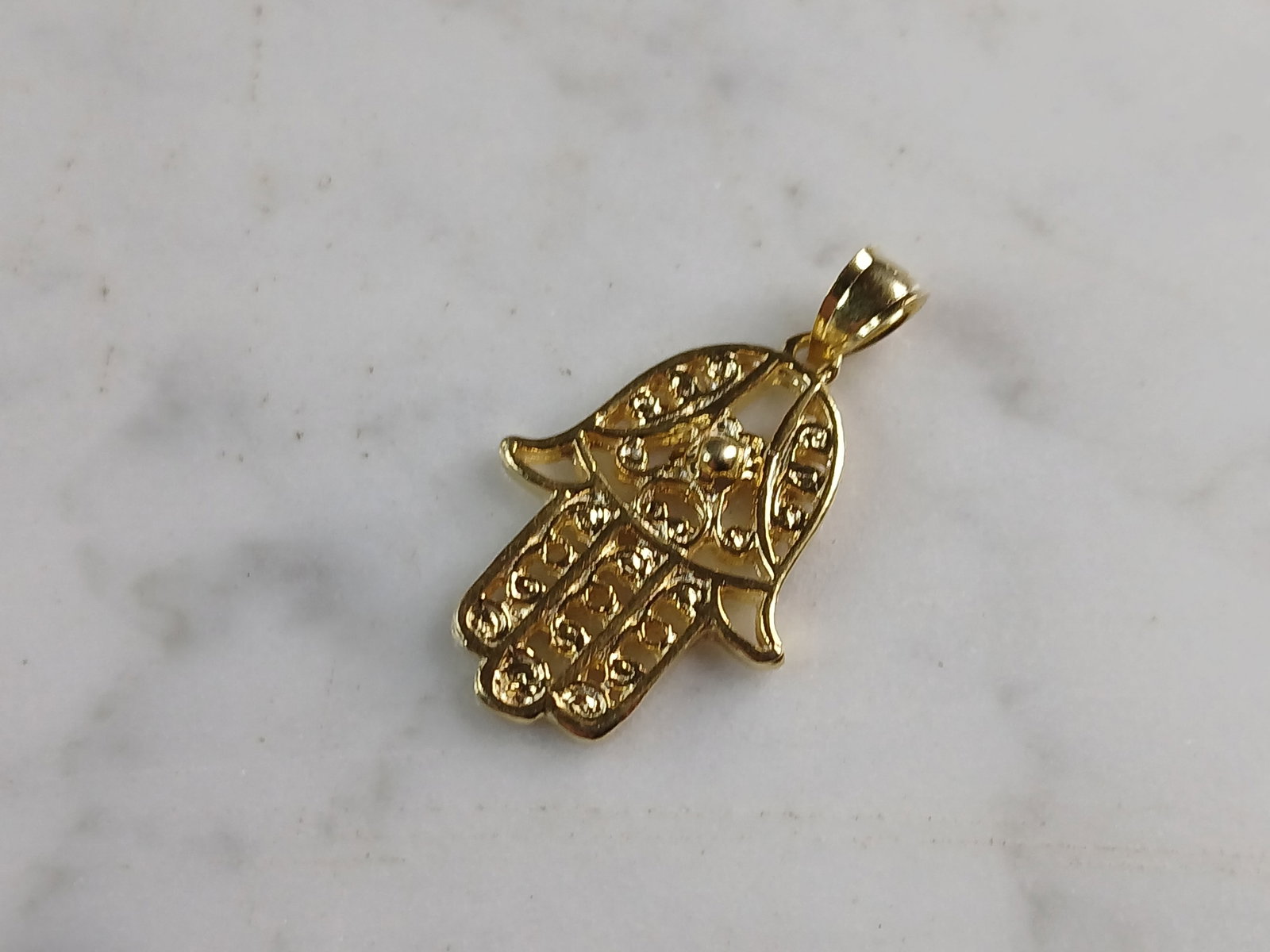 Womens Sterling Silver Gold Tone Hamsa Hand Pendant: A WOMENS STERLING SILVER GOLD TONE HAMSA HAND PENDANT. THE PENDANT WEIGHS 2.7g, AND MEASURES 1 1/4" BY 5/8". MAKES A GREAT GIFT FOR THAT SPECIAL SOMEONE. ANY QUESTIONS, PLEASE DO NOT HESITATE TO ASK.