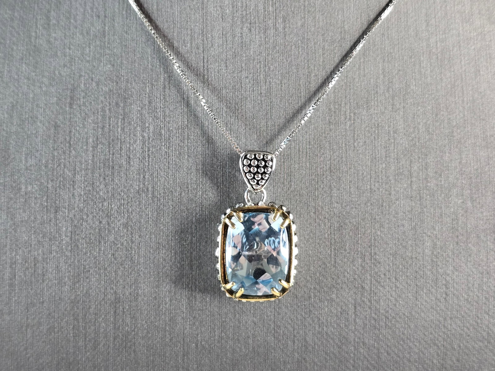 Womens Vintage Estate Sterling Silver Topaz Pendant Necklace: A WOMENS VINTAGE ESTATE STERLING SILVER TOPAZ COLORED MODERNIST PENDANT NECKLACE. THE TOTAL WEIGHT IS 12.5g. NECKLACE MEASURES 18" LONG, AND THE PENDANT IS 1" BY 5/8". NOT SURE IF THE STONE IS NATURAL