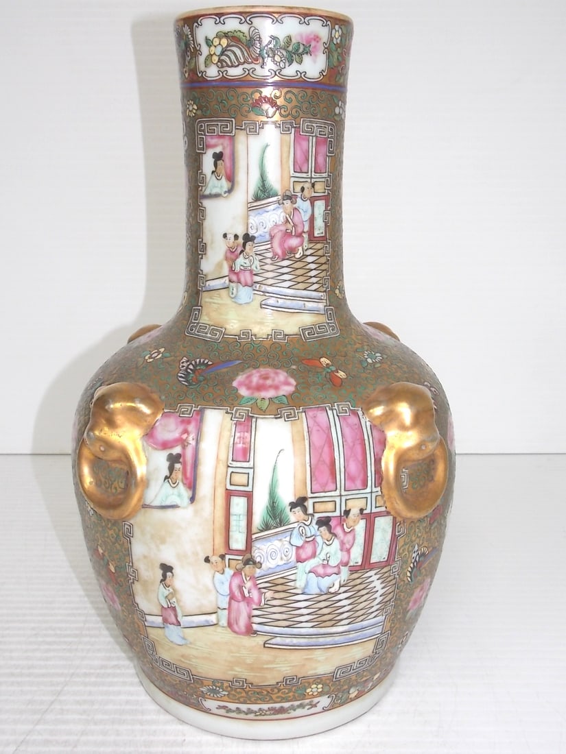HAND PAINTED CHINESE PORCELAIN ROSE MEDALLION VASE: HAND PAINTED CHINESE ROSE MEDALLION VASE WITH GOLD OVERLAY AND FOO DOG RINGS BY WAH TUNG STANDS 17 1/4 INCHES TALL AND MEASURES 10 INCHES IN DIAMETER. Wah Tung Porcelain: Wah Tung has specialized in m