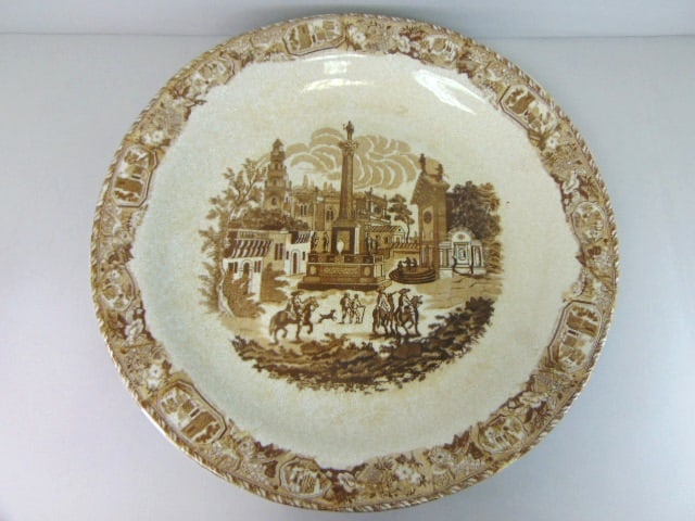 Brown & White Transferware Porcelain Charger Plate: LARGE HAND DECORATED BROWN & WHITE CHARGER WITH EUROPEAN SCENE AND ANTIQUED CRACKLE GLAZE FINISH MEASURES 19 INCHES IN DIAMETER. WOULD LOOK GREAT IN ANY ROOM IN YOUR HOUSE. IF THERE ARE ANY ISSUES PLE