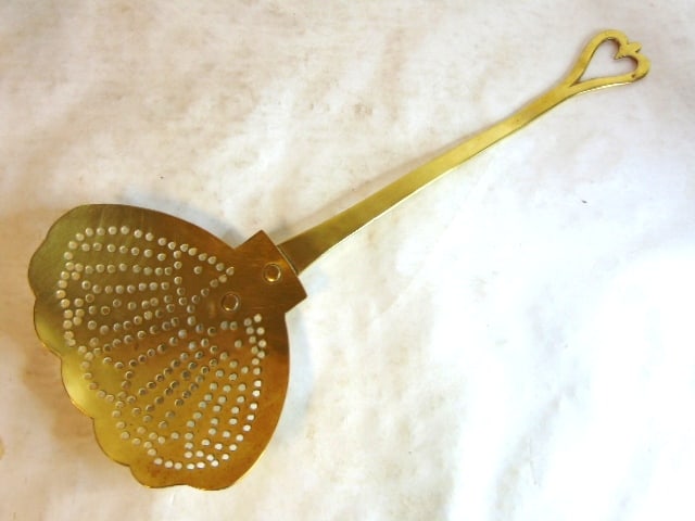 Decorative Vintage Brass Ladle Skimmer Strainer Utensil: A lovely decorative vintage brass ladle skimmer that measures 18 1/4" long by 7 3/4" wide. Condition looks great. Any questions please do not hesitate to ask. Shipping and handling is $25 within the C