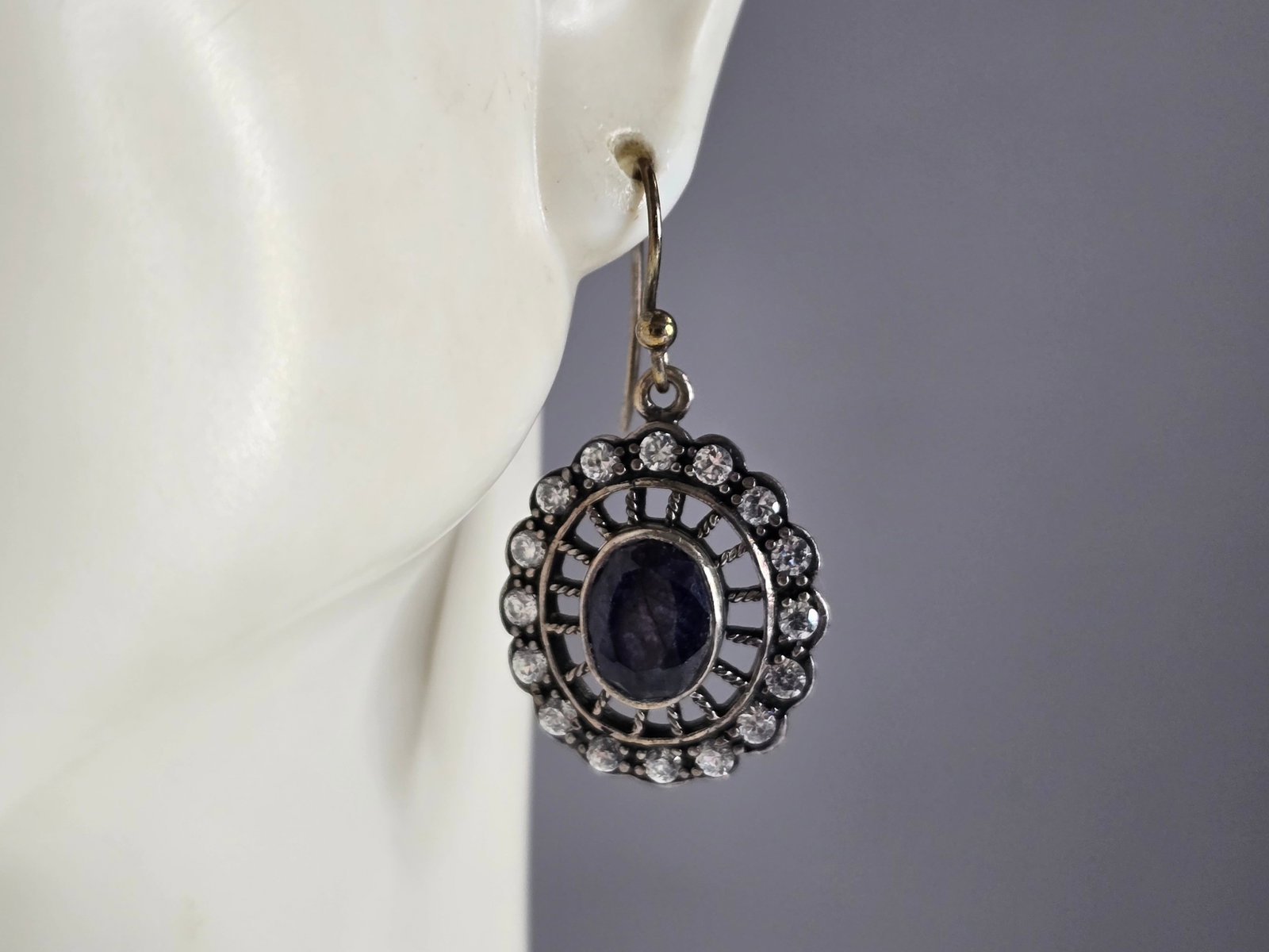Womens Vintage Estate Sterling Silver Natural Sapphire CZ Earrings: A PAIR OF WOMENS VINTAGE ESTATE STERLING SILVER EARRINGS WITH WHAT APPEARS TO BE NATURAL SAPPHIRE STONES WITH CZ ACCENTS. THE EARRINGS WEIGH 6.8g AND MEASURE 1 1/4" BY 3/4". ANY QUESTIONS PLEASE DO NO