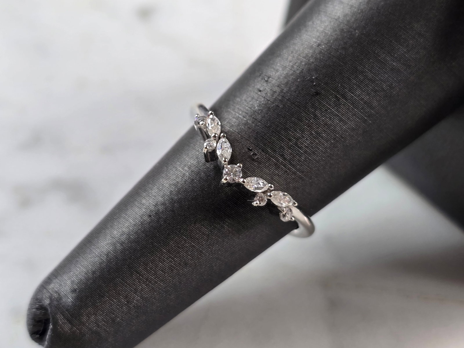 Womens Vintage Estate 14K White Gold Marquise Diamond Ring: A WOMENS VINTAGE ESTATE 14K WHITE GOLD DIAMOND RING. THE RING WEIGHS 1.9g. THE SIZE OF THE RING IS A 6.25. THE WIDTH OF THE RING IS 1/8". THERE ARE ABOUT 0.25cts OF DIAMONDS . ANY QUESTIONS PLEASE ASK