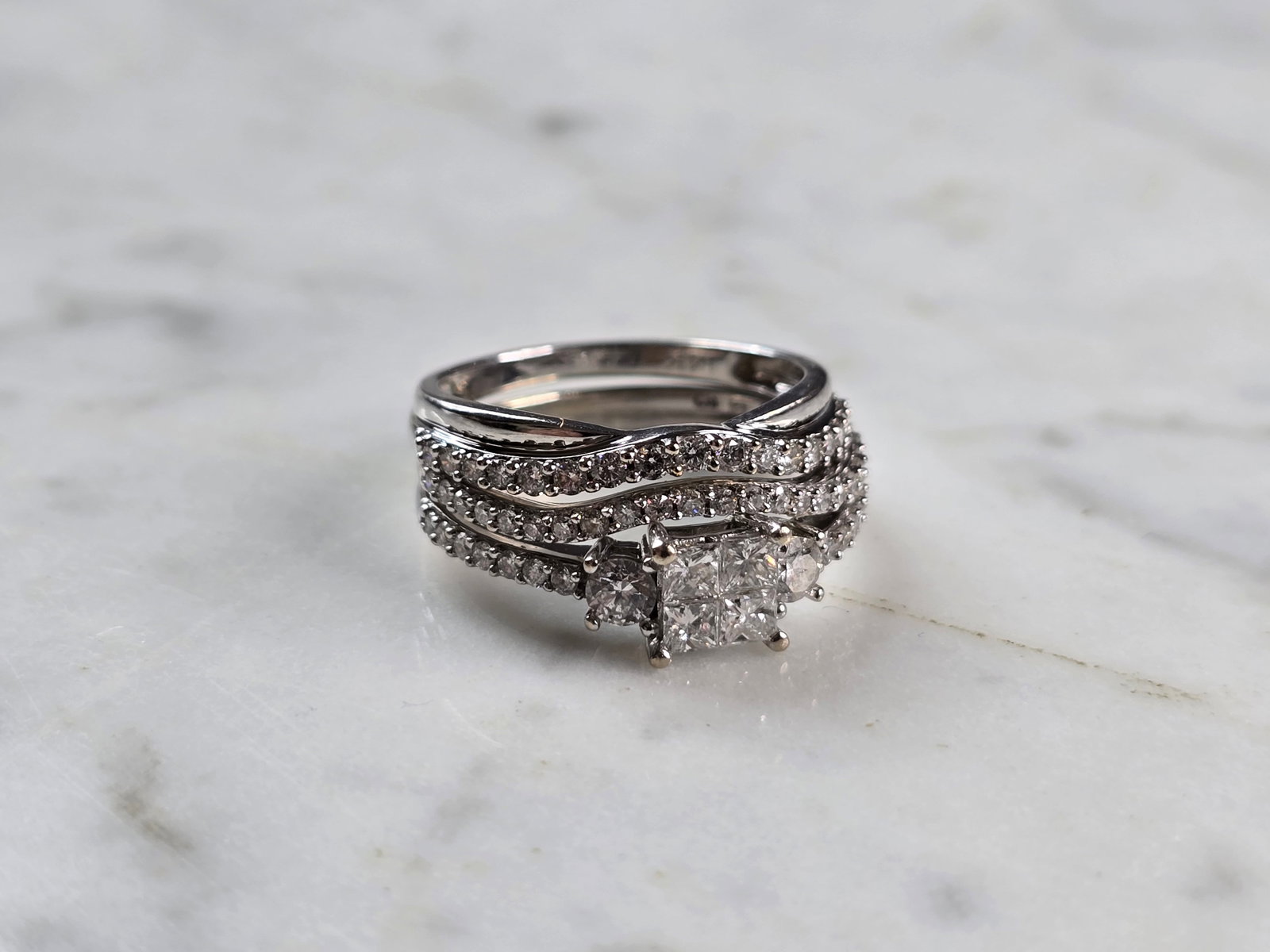 Womens Vintage Estate 14K White Gold Diamond Ring Set: A WOMENS VINTAGE ESTATE 14K WHITE GOLD DIAMOND RING SET. THE RING IS A SIZE 7.75, AND WEIGHS 5.4g. THERE ARE ABOUT 1.20cts OF DIAMONDS. RING IS MARKED ON THE INSIDE OF BOTH, AS SHOWN IN THE PICS. THE 