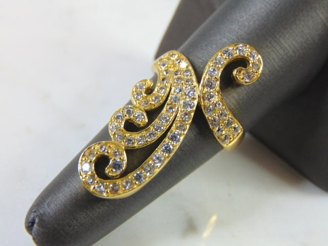 Womens Sterling Silver Gold Tone Fashion Ring: A STERLING SILVER GOLD TONE FASHION RING THAT WEIGHS 5.5g AND IS A SIZE 7.25. THE FACE MEASURES 1 1/4" BY 3/4". RING IS STAMPED "925". ANY QUESTIONS PLEASE DO NOT HESITATE TO ASK. BE SURE TO CHECK OUT