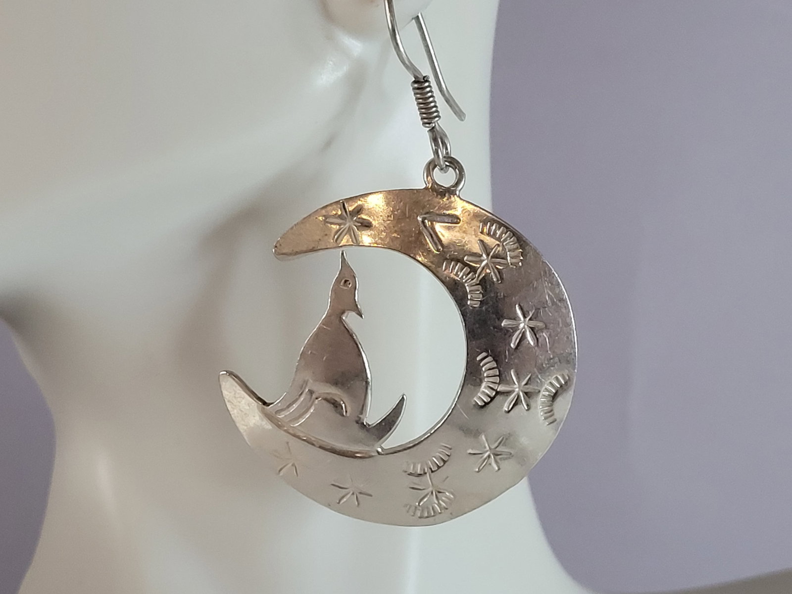 Womens Vintage Sterling Silver Southwestern Wolf Moon Earrings: A PAIR OF WOMENS VINTAGE ESTATE STERLING SILVER SOUTHWESTERN WOLF & MOON EARRINGS. THE EARRINGS WEIGH 17.2g AND MEASURE 2" BY 1 1/4". EARRINGS ARE MARKED ON THE BACK. ANY QUESTIONS PLEASE DO NOT HESIT