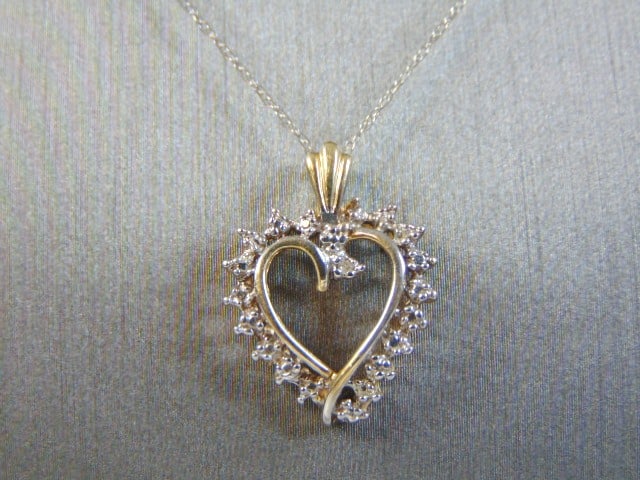 Vintage 10k Gold Necklace w/ Diamond Heart Pendant: A LOVELY VINTAGE ESTATE 10K WHITE GOLD FINE LINK NECKLACE WITH 10K YELLOW GOLD DIAMOND HEART PENDANT. THE HEART HAS TOTAL OF .6K ROUND SMALL DIAMONDS. THE NECKLACE AND PENDANT WEIGHS 2.0g. NECKLACE ME
