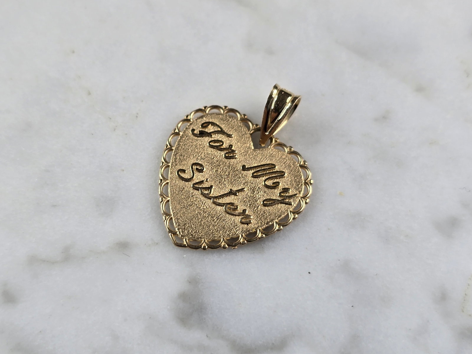 Womens Vintage 14k Gold Michael Anthony Sister Love Heart Pendant: A WOMENS VINTAGE ESTATE 14K GOLD SISTER LOVE HEART PENDANT MADE BY MICHAEL ANTHONY. THE TOTAL WEIGHT IS 1.2g. THE PENDANT MEASURES 3/4" LONG BY 5/8" WIDE. PENDANT IS MARKED ON THE BACK. MAKES A GREAT 