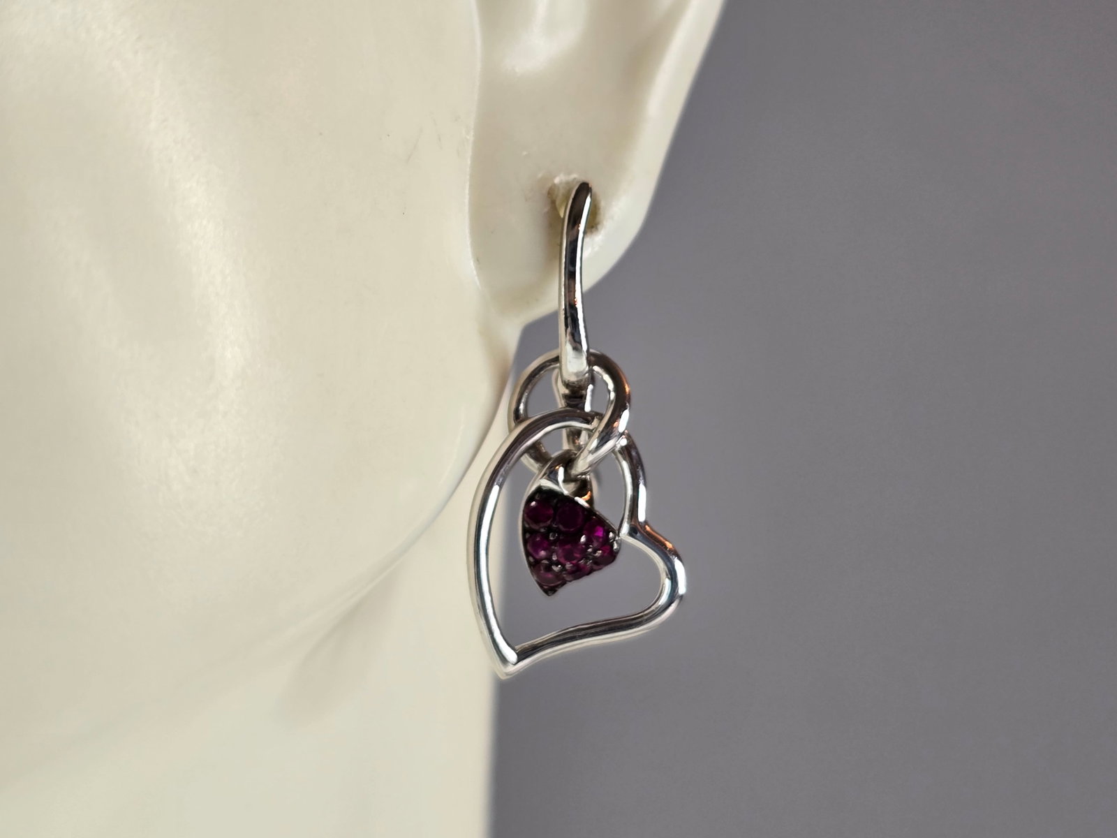 Womens Estate Sterling Silver Amethyst Colored Heart Earrings: A PAIR OF WOMENS ESTATE STERLING SILVER AMETHYST COLORED EARRINGS. EARRINGS WEIGH 2.7g, AND MEASURE 1" LONG BY 1/2" WIDE. ANY QUESTIONS, PLEASE DO NOT HESITATE TO ASK. BE SURE TO CHECK OUT SOME OF MY 