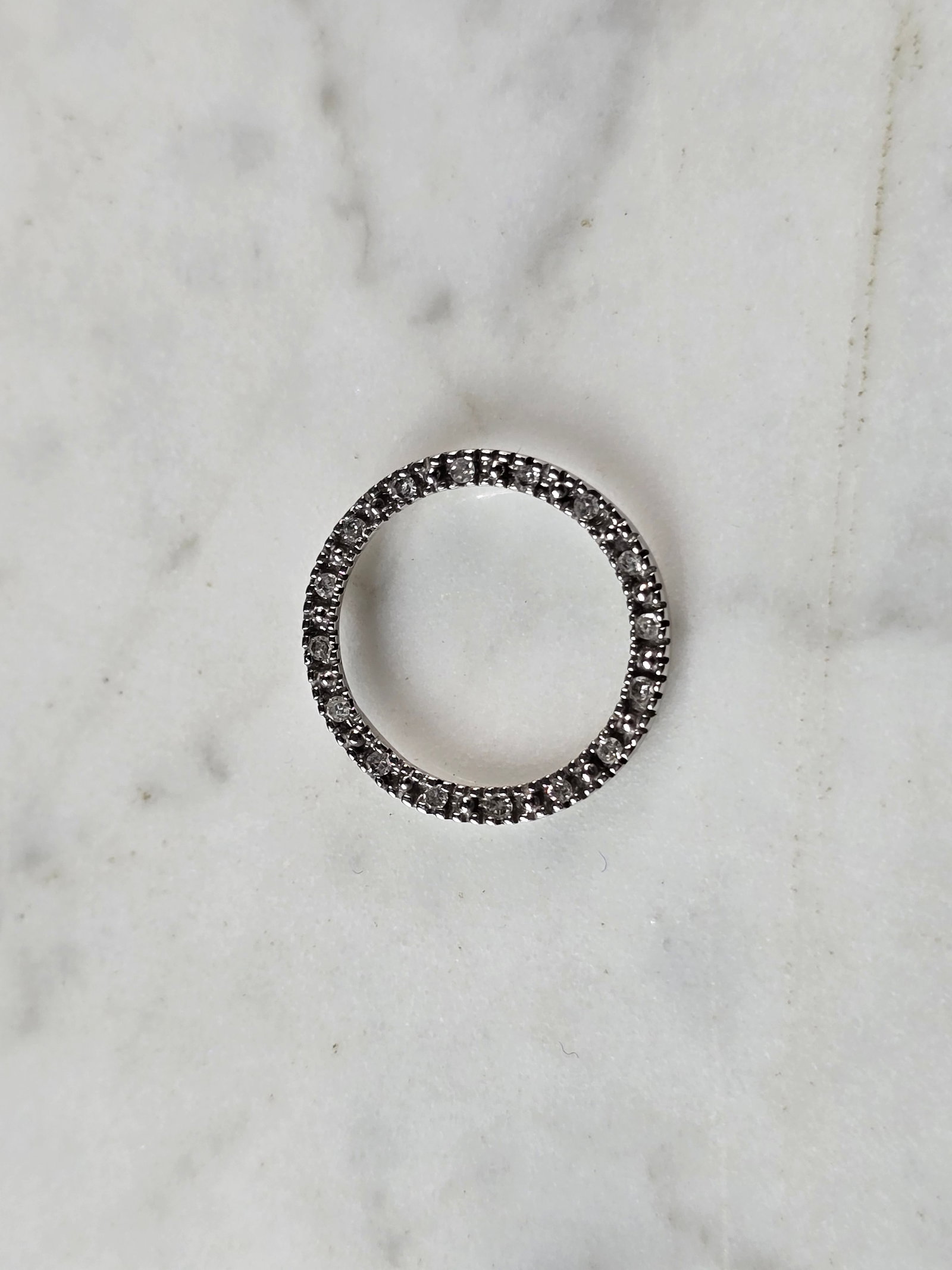 Womens Vintage Estate 10K White Gold Diamond Eternity Pendant: A WOMENS VINTAGE ESTATE 10K WHITE GOLD DIAMOND ETERNITY PENDANT. PENDANT HAS 16 TINY DIAMONDS IN IT AND WEIGHS 0.9g. PENDANT MEASURES 3/4". WOULD MAKE A LOVELY GIFT FOR THAT SOMEONE SPECIAL. ANY QUEST