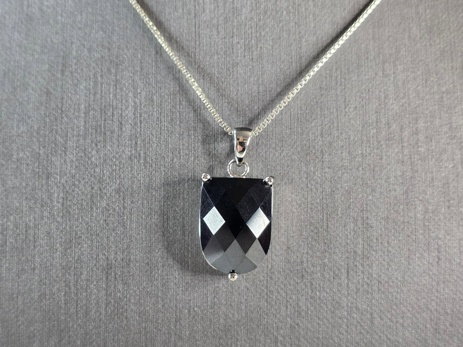 Womens Estate Sterling Silver Modernist Pendant Necklace: A WOMENS ESTATE STERLING SILVER ONYX COLORED PENDANT WITH NECKLACE . THE PENDANT MEASURES 1 1/8" LONG BY 1/2" WIDE. THE NECKLACE MEASURES 18 1/2" LONG. TOGETHER THEY WEIGH 10.2g. NOT SURE IF STONE IS 