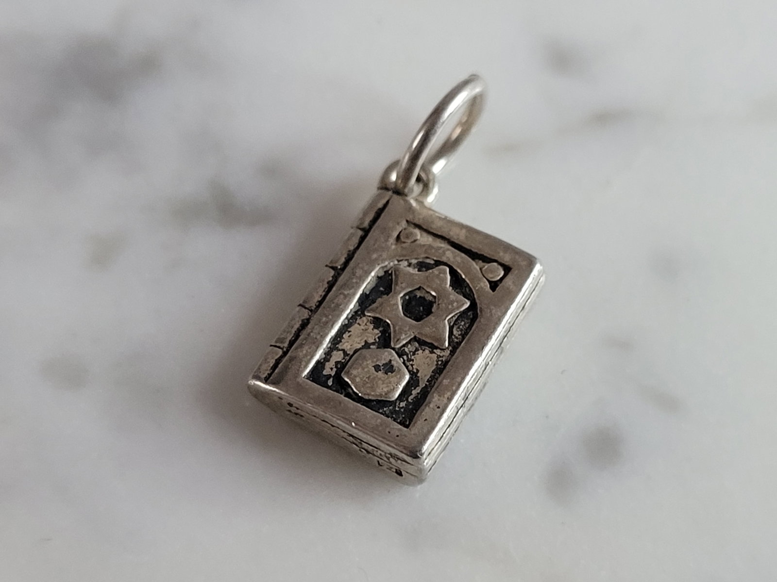 Sterling Silver Jewish Judaica Hebrew Torah Charm Pendant: A STERLING SILVER JEWISH HEBREW TORAH CHARM PENDANT. PENDANT WEIGHS 3.0g, AND MEASURES 3/4" LONG BY 3/8" WIDE. MAKES A GREAT GIFT FOR THAT SOMEONE SPECIAL. ANY QUESTIONS, PLEASE ASK. BE SURE TO CHECK 